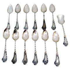 Set of twelve silver teaspoons
sugar scoop w/ wavy handles
monogram cards
