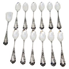 Set of twelve silver teaspoons
sugar shovel w/ floral reliefs on the handles