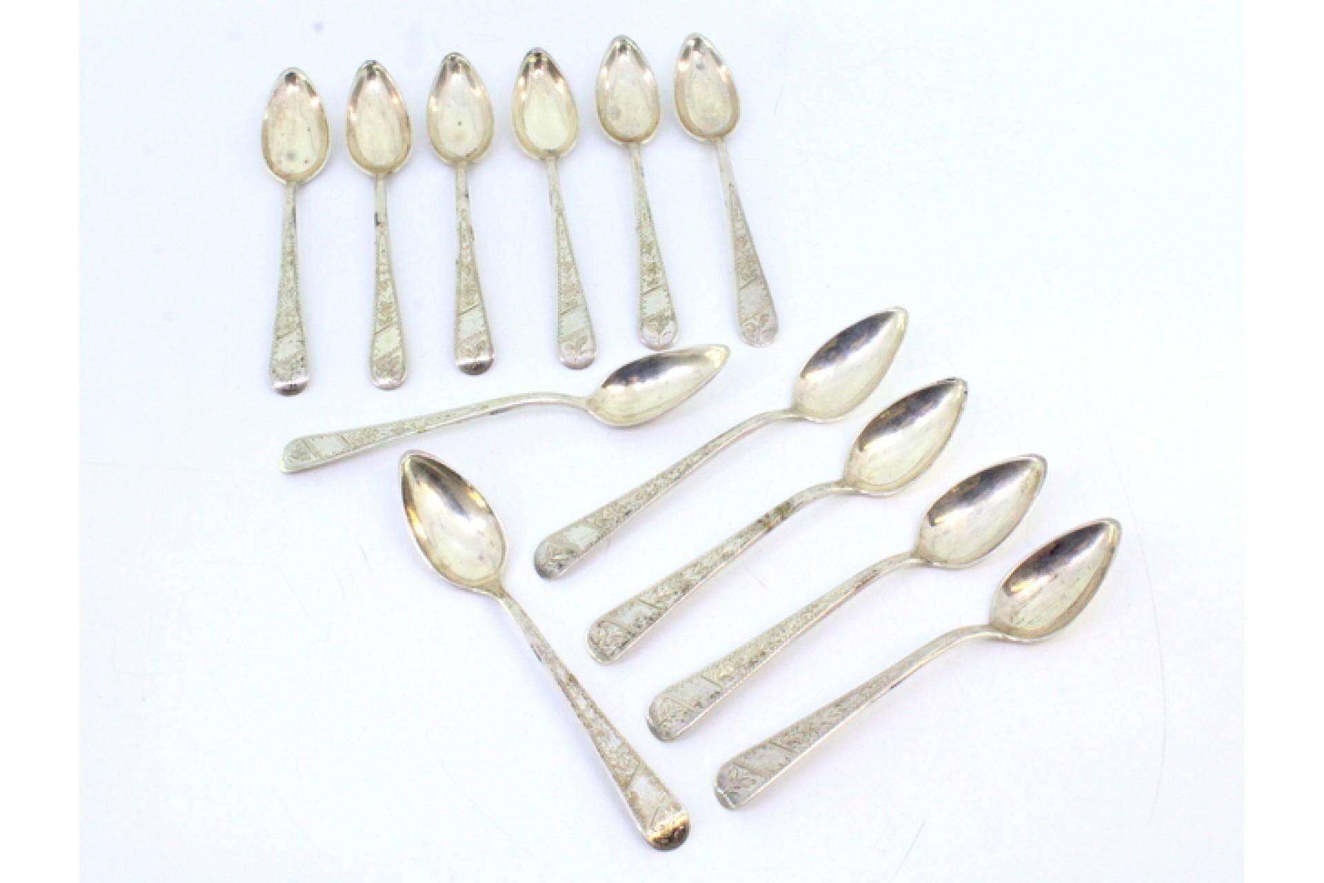 Description: Set of twelve silver teaspoons with floral motifs engraved on the handles. Metal: Silver. Origin: Portuguese. Brand: Javali II Title. Weight: 187.08 grams (Set of twelve spoons). Dimensions: 12.5cmx2.2cm. Content: 833/1000. Assay Mark:
