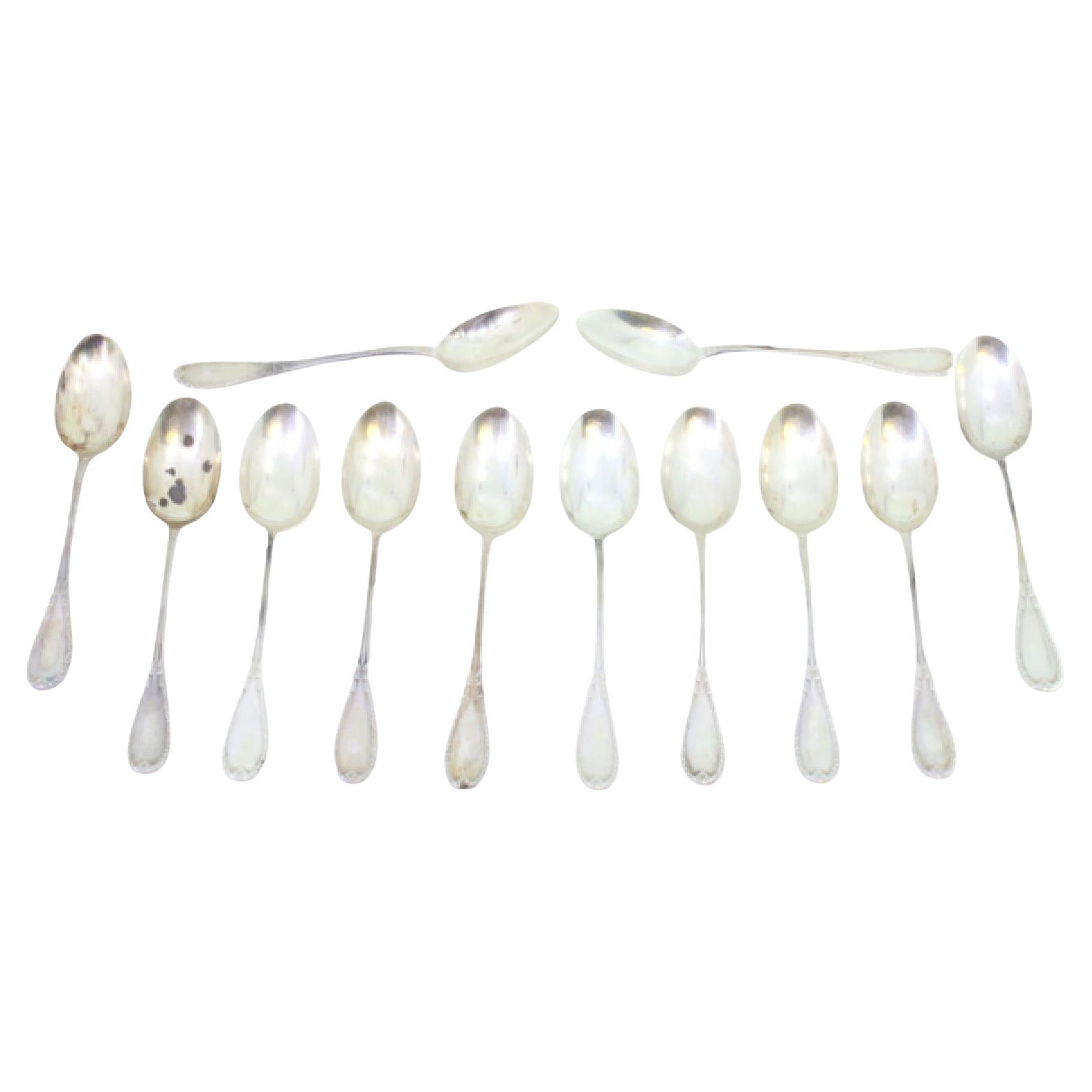 Set of twelve silver teaspoons with grooved handles