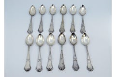 Set of twelve silver teaspoons with reliefs and grooves on the handles