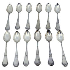 Set of twelve silver teaspoons with reliefs and grooves on the handles