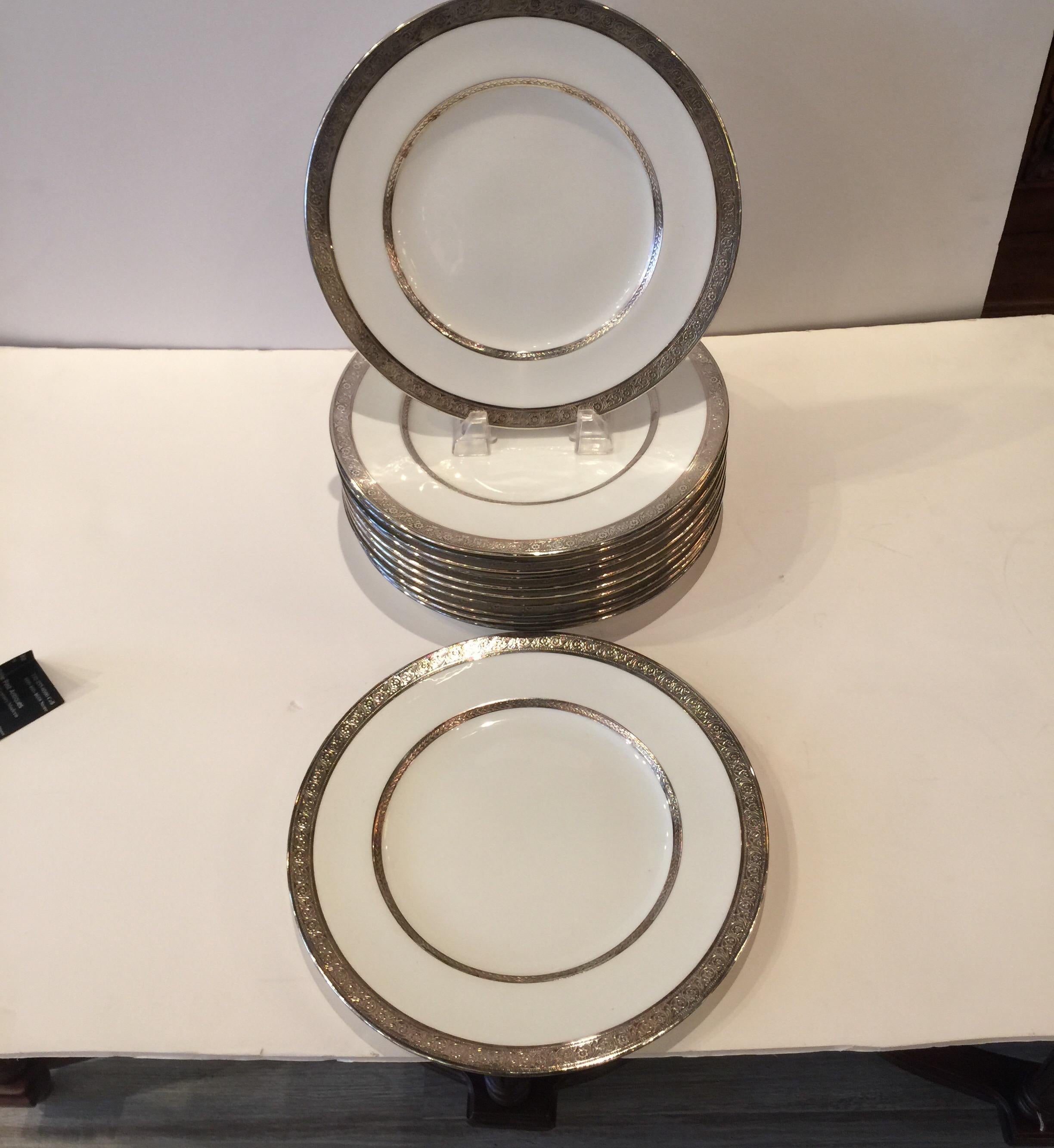 Porcelain Set of Twelve Sterling Silver Overlay Dinner/Service Plates, England