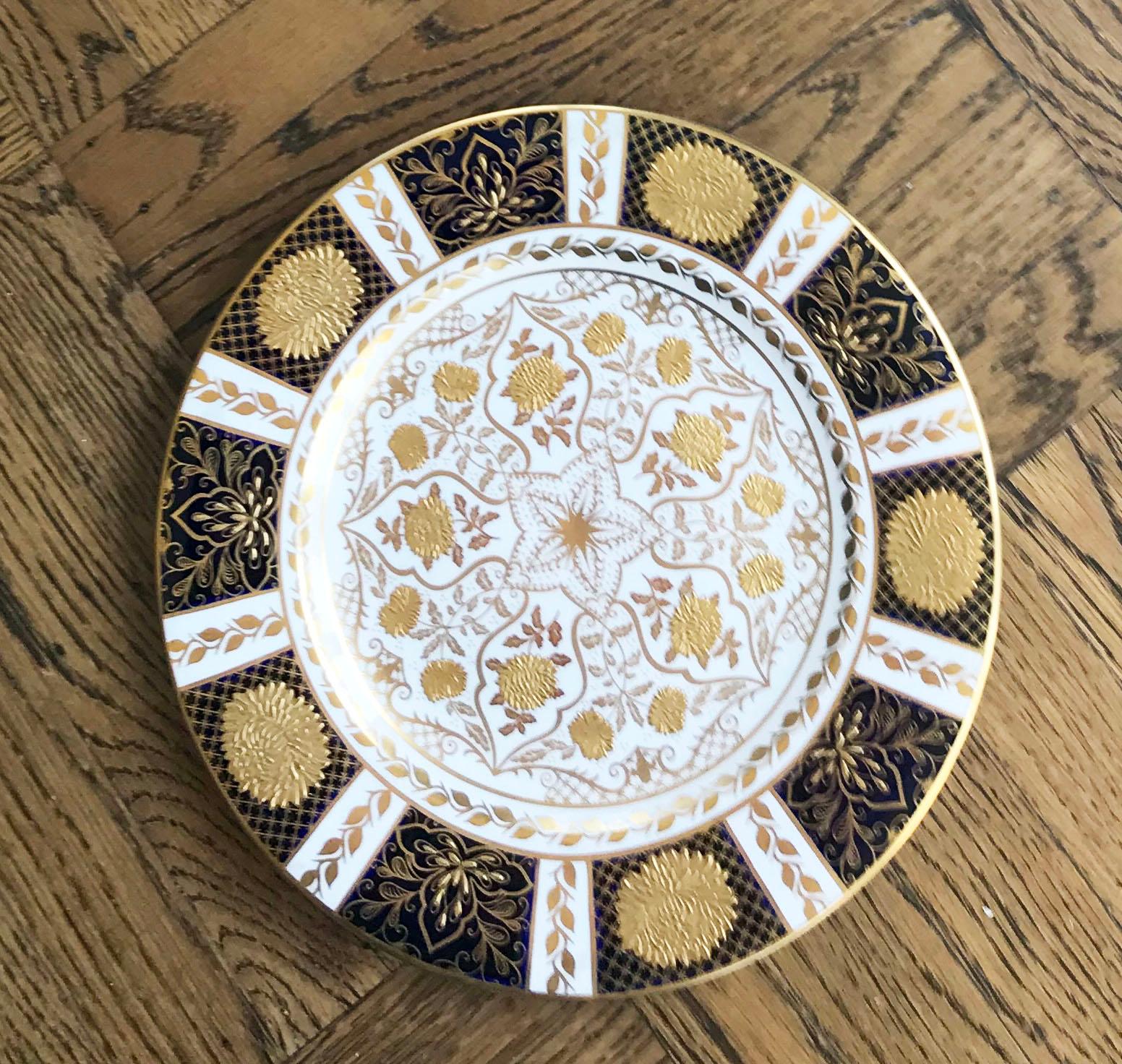 A rare set of twelve gorgeous Abbeydale Duffield/Derbyshire dinner plates in the imperial gold pattern. The plates are bone china and sold for T. Goode & Co., London, made in England. They feature an ornate design of gold chrysanthemum flowers,