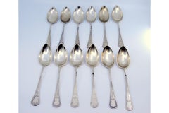 Set of twelve tablespoons in guilloche silver with cartouches on the handles
