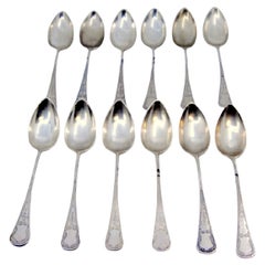Set of twelve tablespoons in guilloche silver with cartouches on the handles