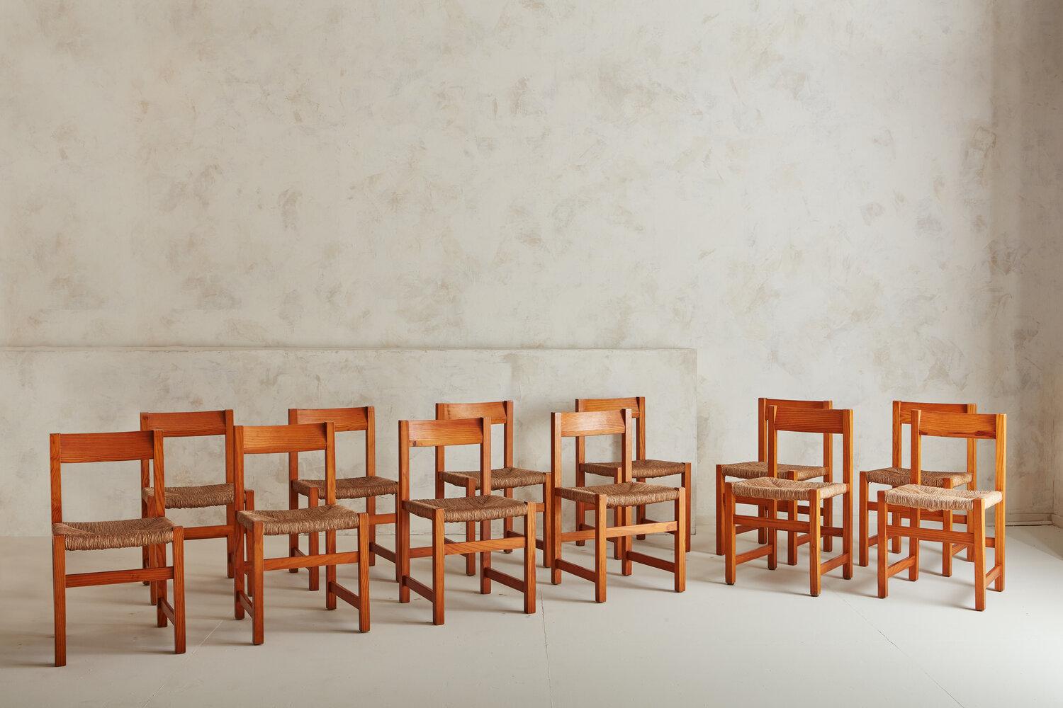 A set of twelve Valsain pine and rushing dining chairs by Spanish industrial designer Joaquim Belsa Aldea. Sourced in Northern Spain, 1970s. It’s so rare to find a vintage set of this quantity and condition!