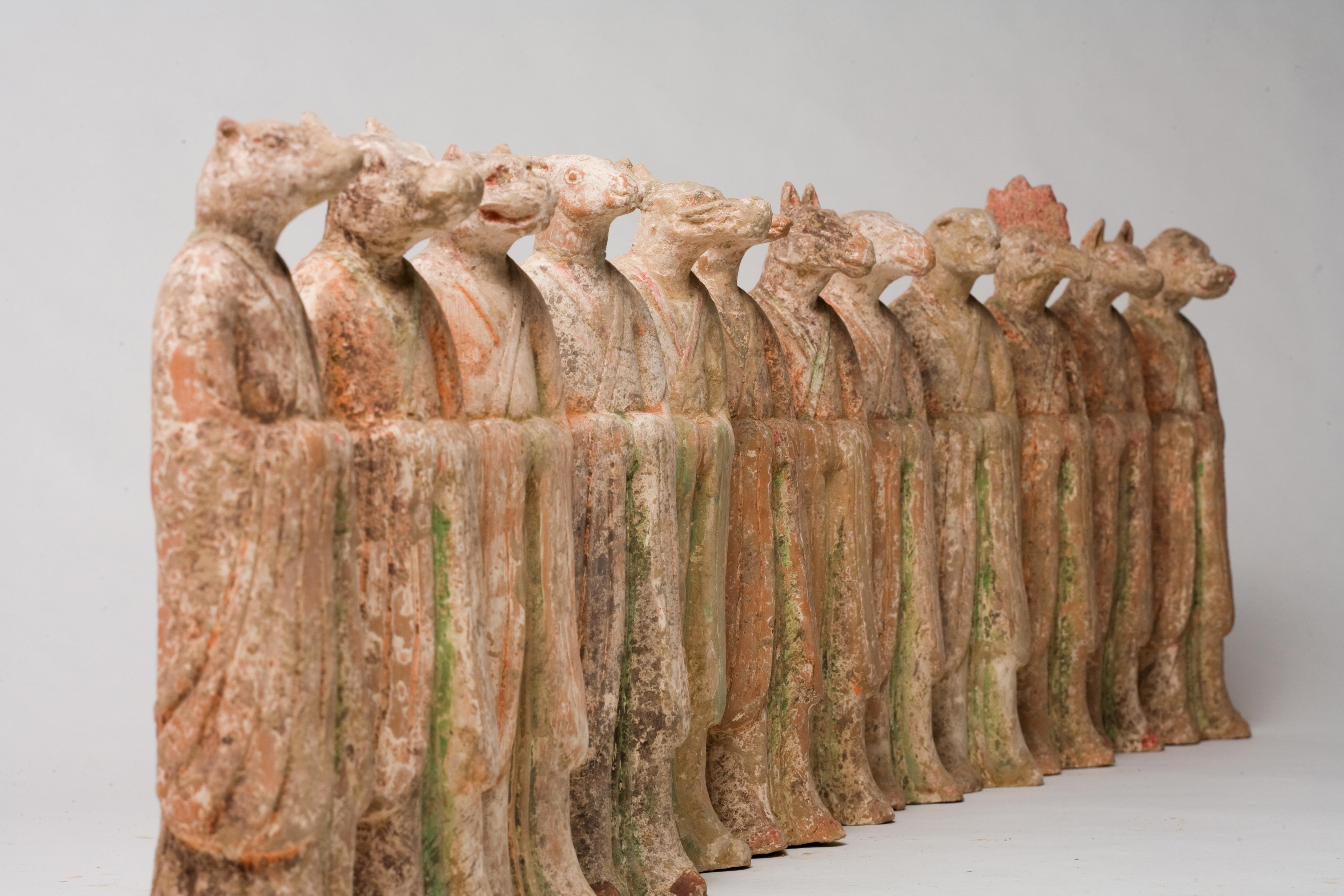 The twelve Chinese zodiac animals are more than just symbols of the calendar—they were once powerful guardians of the afterlife. During the Tang dynasty (618–907 CE), these figures were placed in tombs, dressed in official robes, to ward off evil
