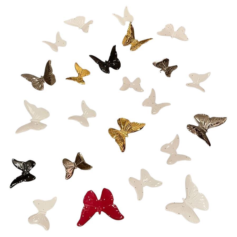 Set di ventitré farfalle in porcellana italiana, anni '70.