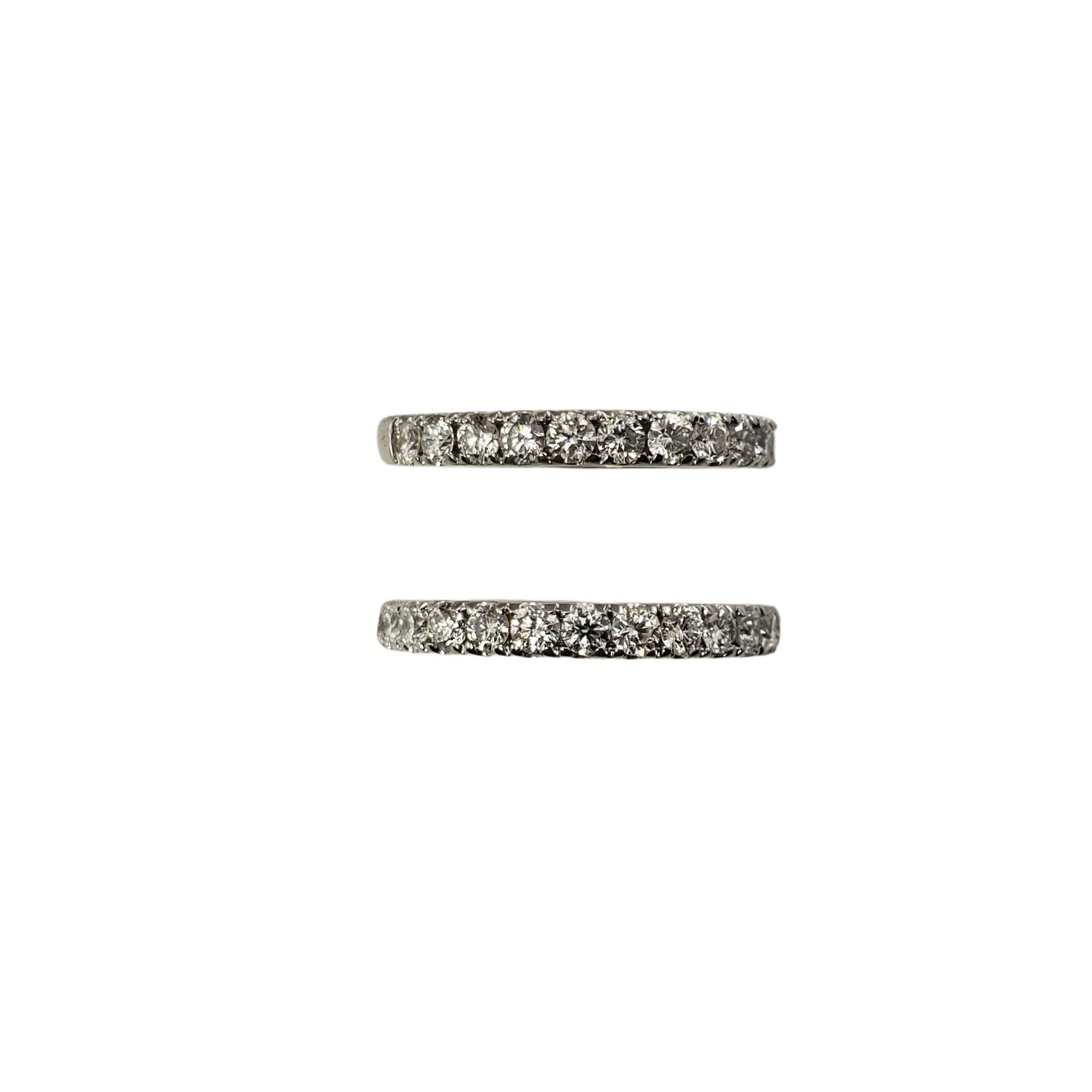 Set of Two 14 Karat White Gold and Diamond Wedding Band Ring Size 5.75

This set of two wedding bands each feature 14 round brilliant cut diamonds set in classic 14K white gold.

Individual band width: 3 mm.

Approximate total diamond weight: 1.05 -