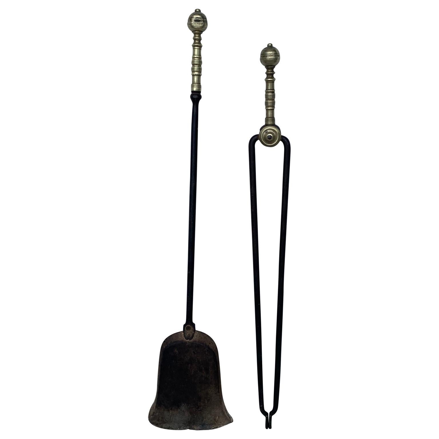 Set of two 18th century brass and iron fireplace tools.