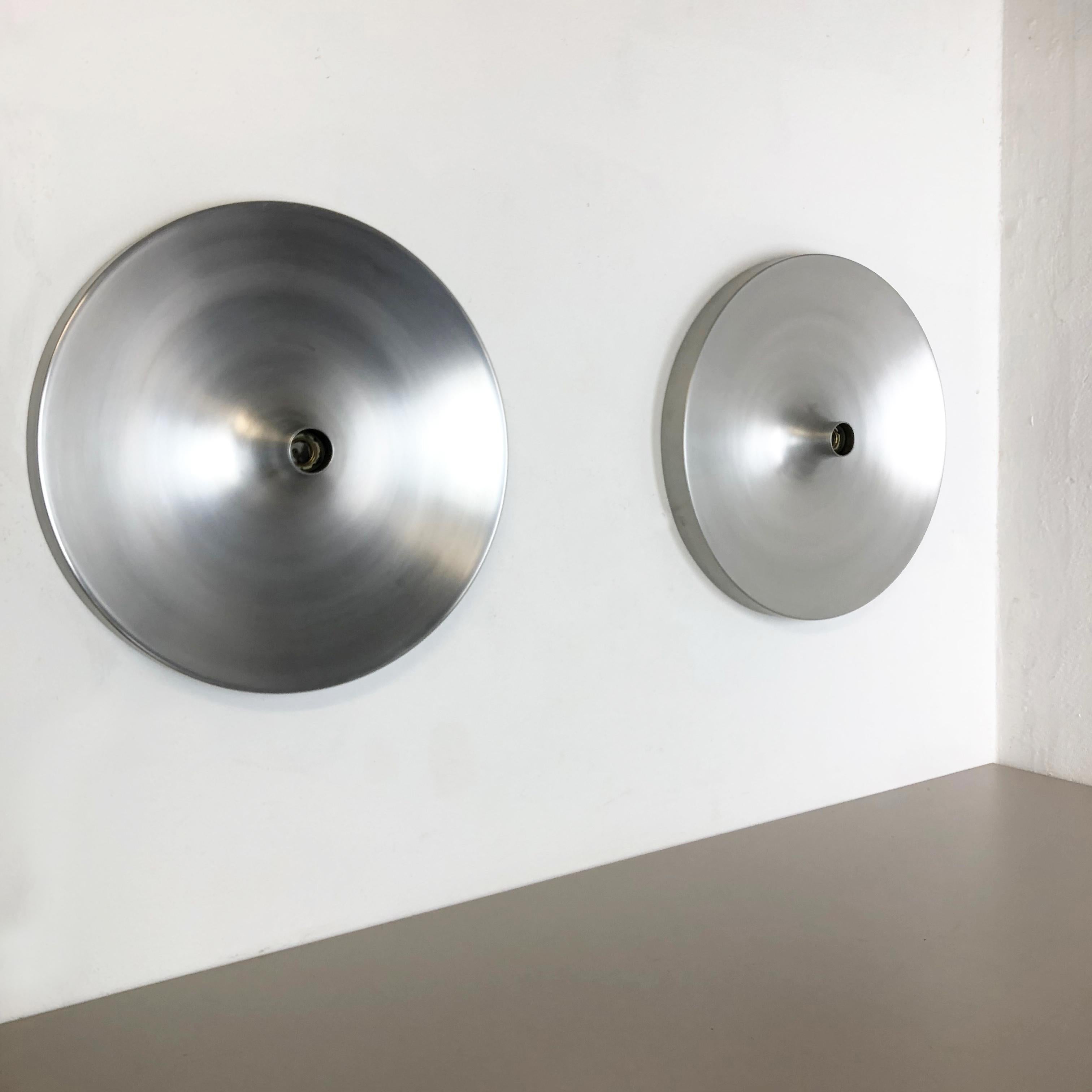 Article:

Extra large wall light sconce set of two


Producer:

Staff Lights



Origin:

Germany



Age:

1970s



Original 1960s modernist German wall light made of solid metal with polished surface. This super rare wall