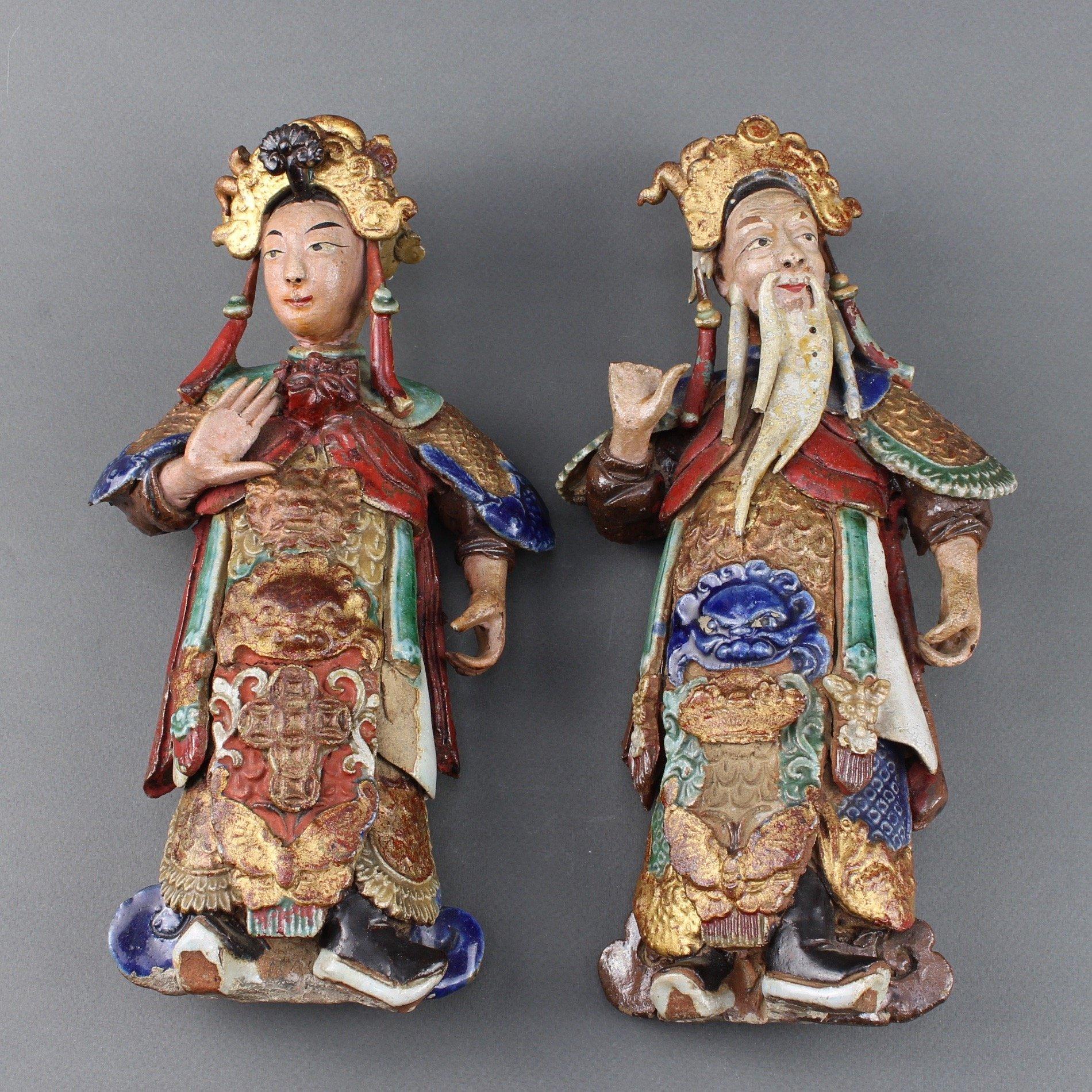 Set of two Chinese earthenware decorative wall-hanging figures (19th century). These two pieces are intriguing. Consulted experts in Asian artworks indicate they were most likely made in Canton, China for European export in the 19th century. They