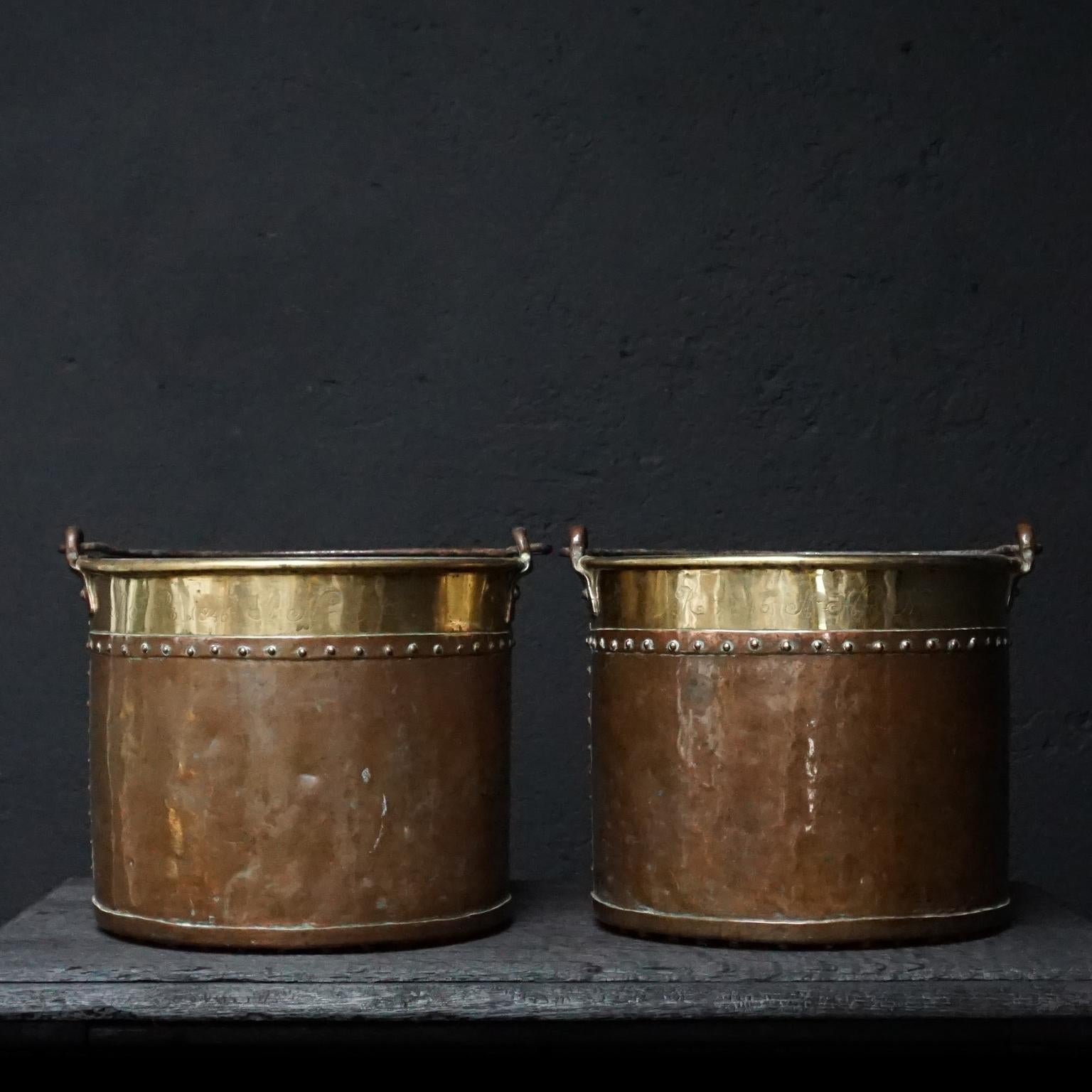 Two decorative copper and brass buckets with riveted base and circumference.
Hammered with date and two initials MJP 1846 AHN.

The initials and the date make me wonder if this was a gift, maybe even a wedding gift.
Also provided with (later