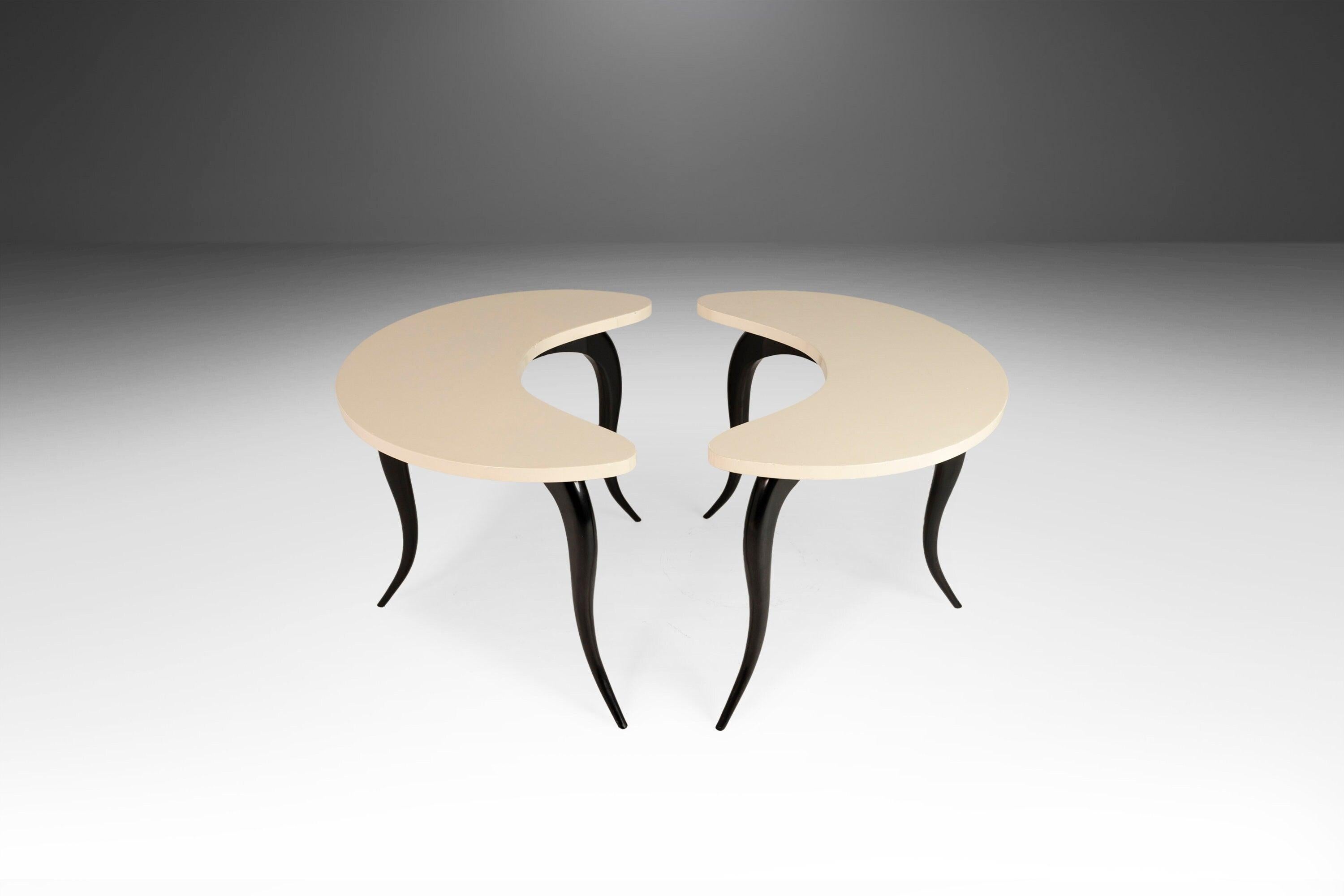 Visually captivating. Audaciously shaped. This gorgeous set of tables, styled after Osvaldo Borsani, is the epitome of 'functional art'. Audaciously shaped with crescent moon tops these end tables are unlike any we've ever seen. Featuring curled