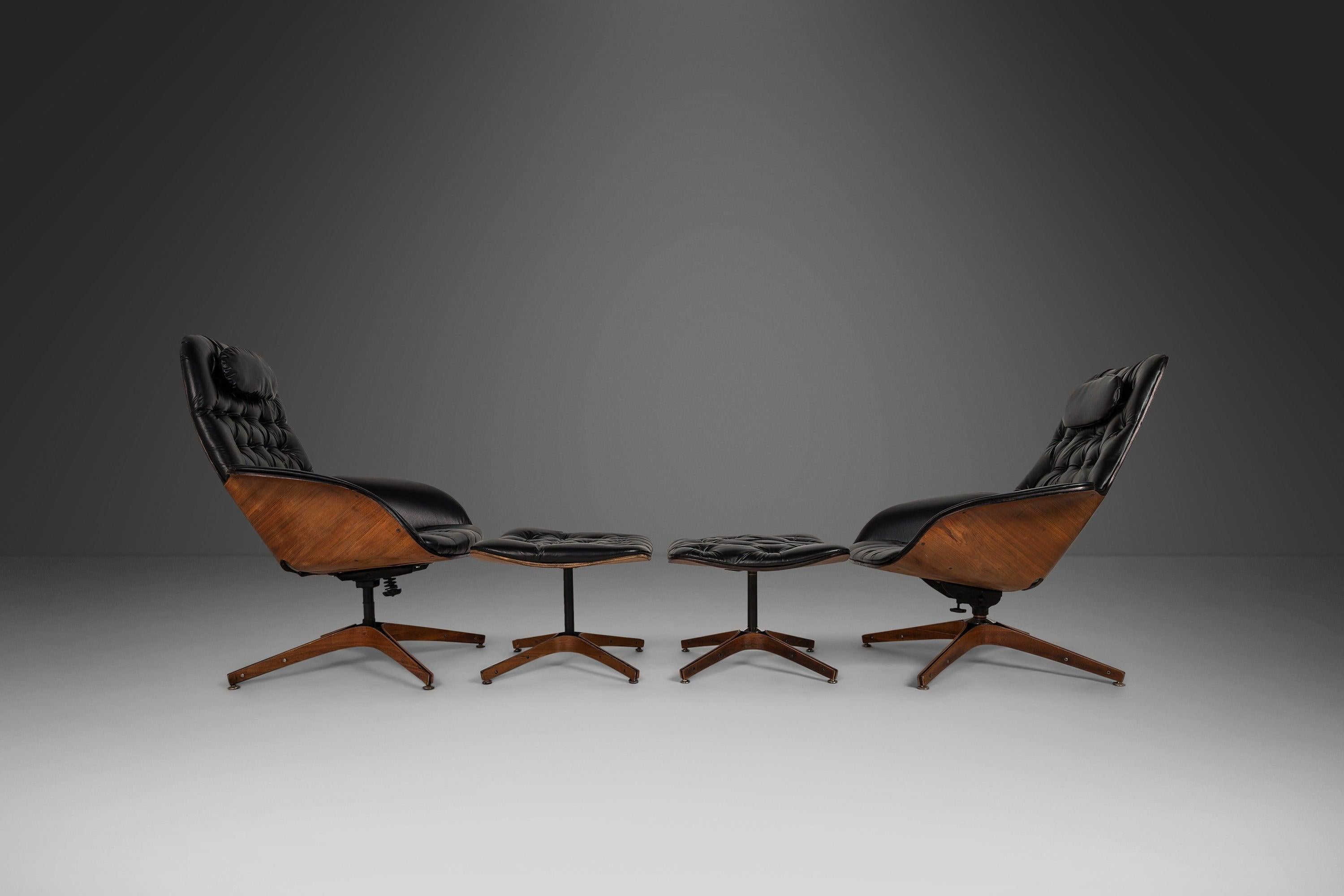 As comfortable as they are iconic this set of lounge chairs and ottomans, designed by the acclaimed George Mulhauser, is the epitome of functional art. Constructed of walnut plywood audaciously shaped and featuring stunning natural woodgrains these