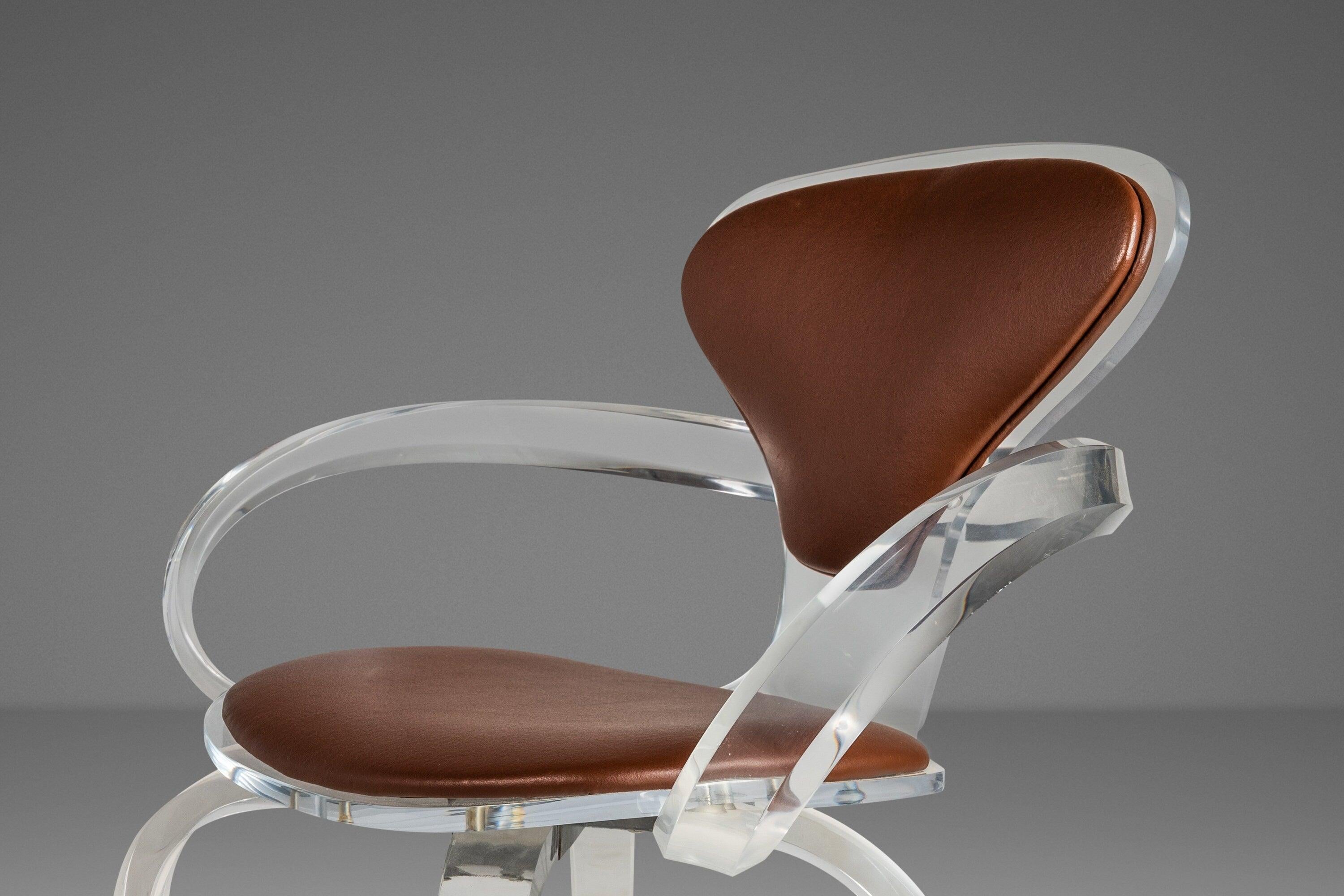 As elegant as they are rare this exquisite set of custom-made pretzel chairs is unlike anything we've ever seen. This extraordinary set is constructed from solid polymethyl methacrylate (AKA lucite) and modeled after the iconic pretzel chair