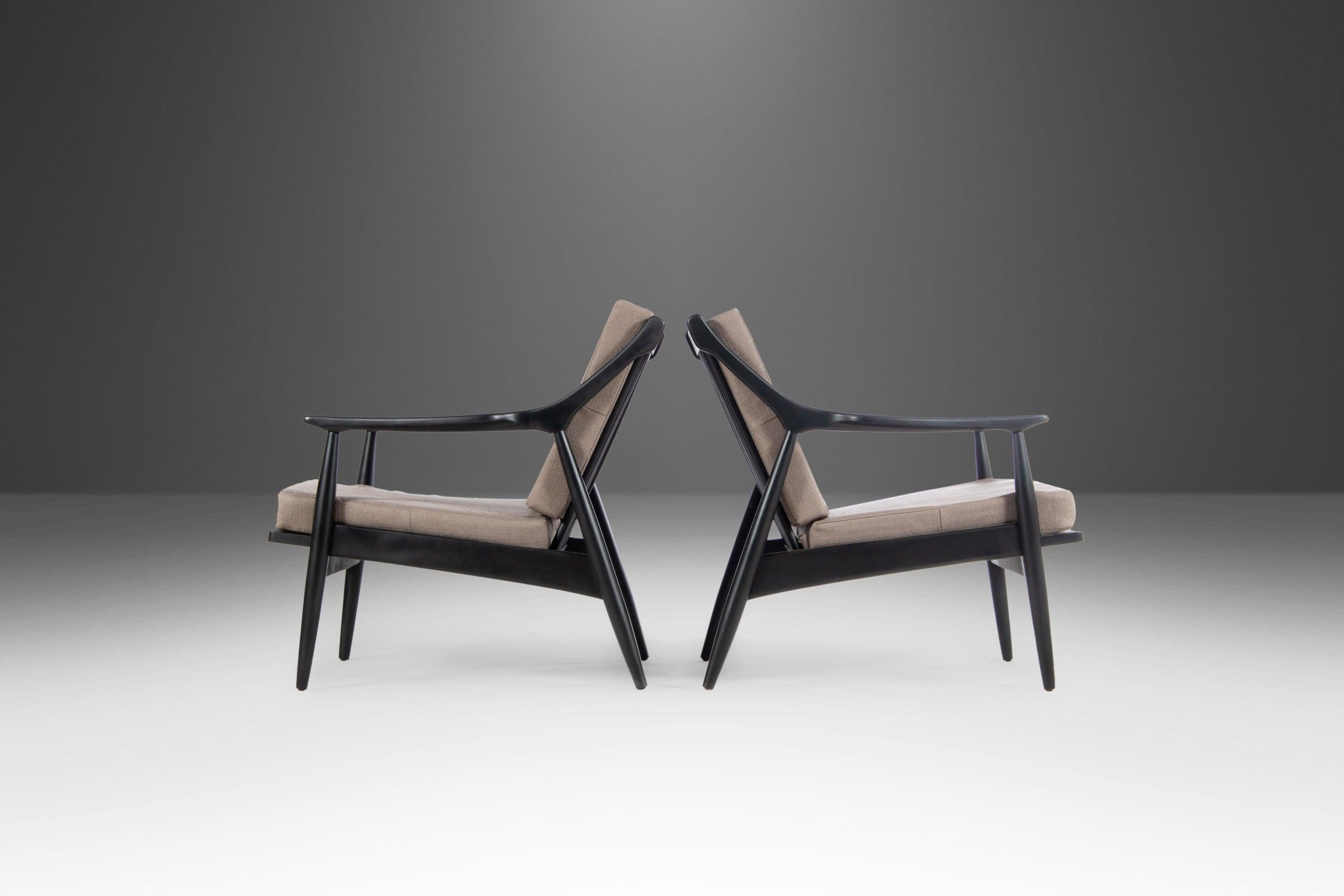 A newly restored set of two lounge chairs by Paoli. Constructed from walnut with excellent attention to contour and lines. Newly painted ebony and newly re-upholstered in Knit Stone Grey by Celione.

---Dimensions---

Width: 26.5 in / 67.31
