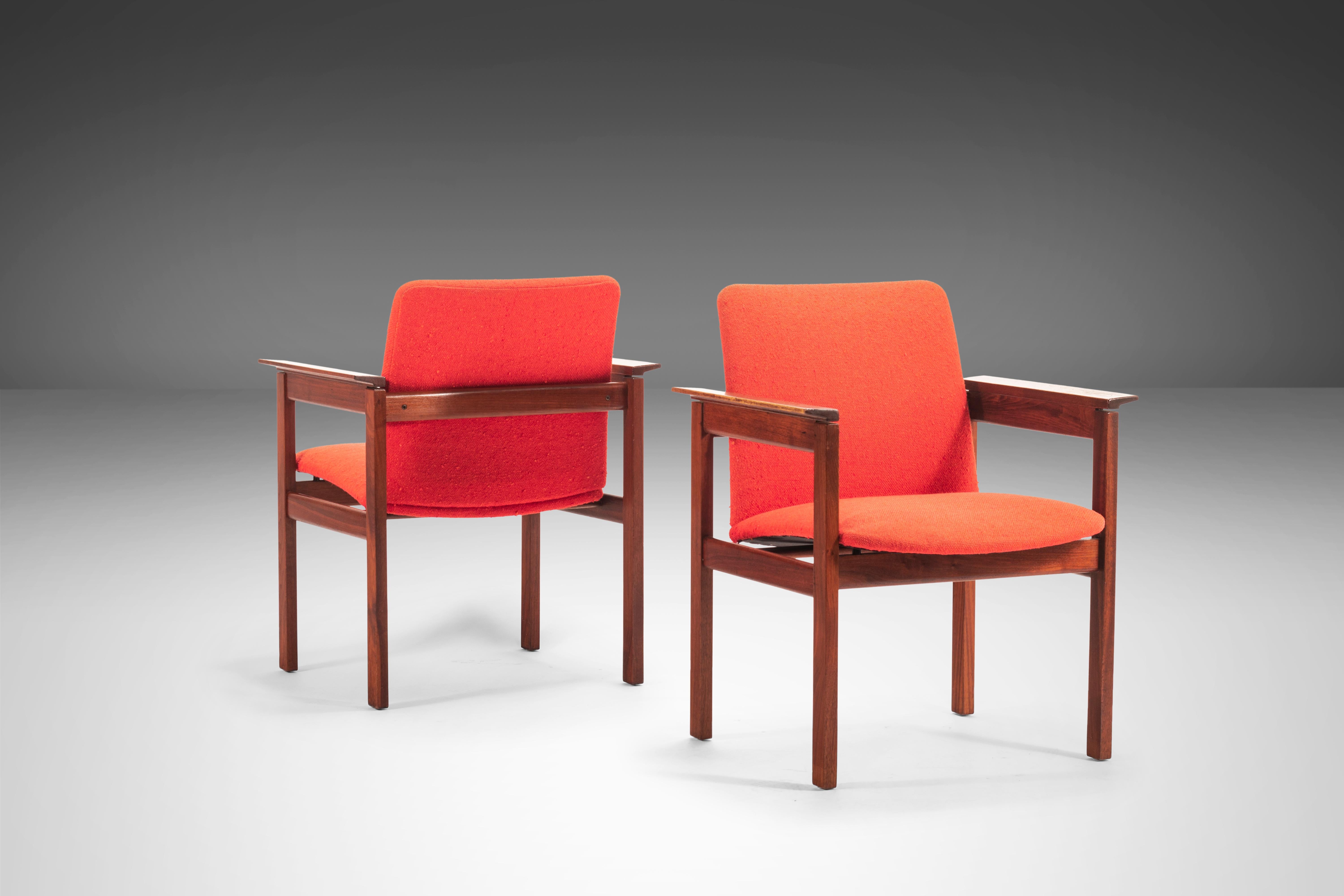 This set of chairs is for the collector with exceptional taste, as it is one of the more profound designs by Jens Risom. Upholstered in original red knit fabric. Constructed on a solid walnut frame; truly exceptional lines and sculpted armrests.