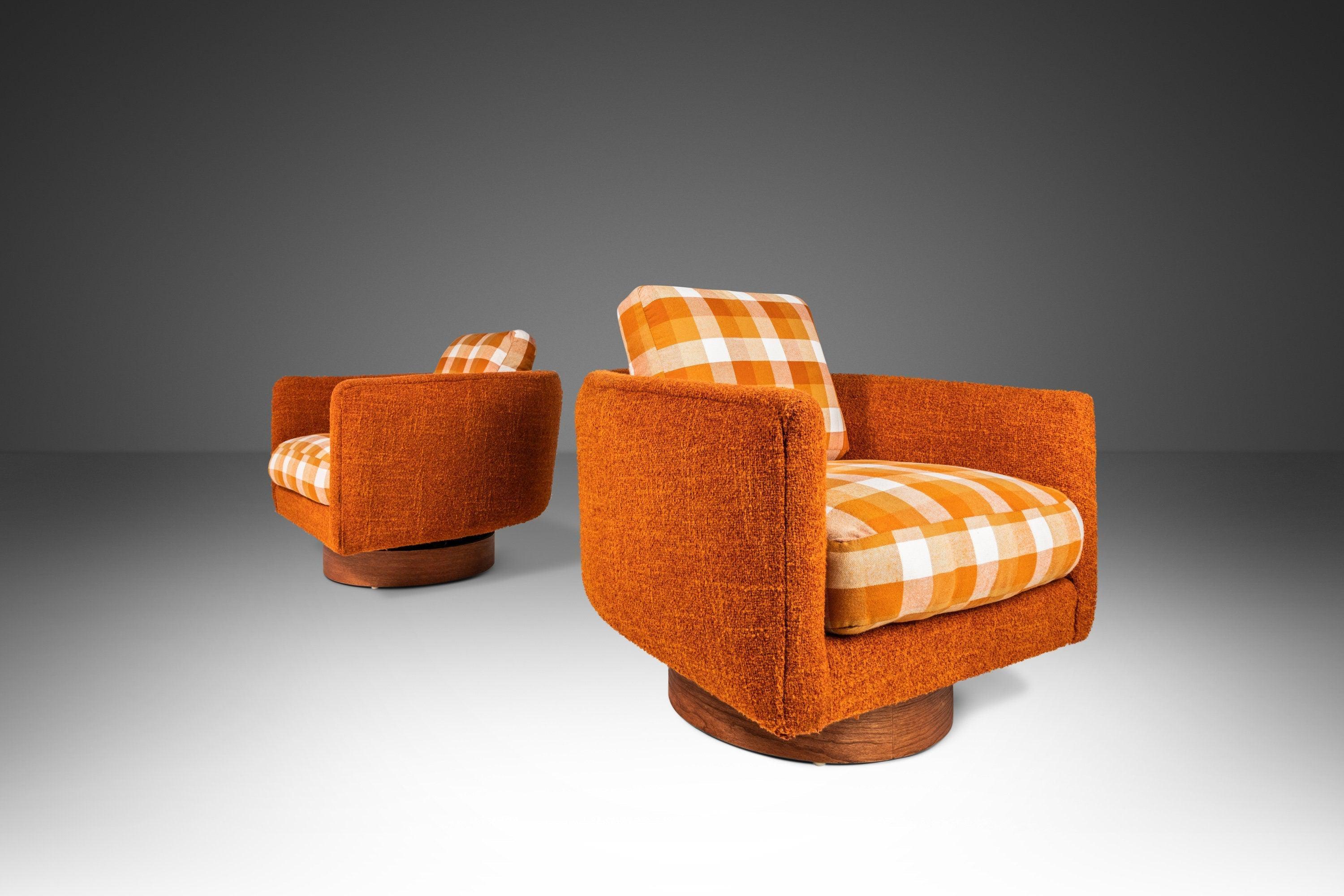 Equal parts comfort and style this remarkable set of tub chairs is epitome of American Modern Design. Complete with the original retro burnt orange tweed upholstery these fascinating chairs are even more than meets the eye. Both chairs swivel 360