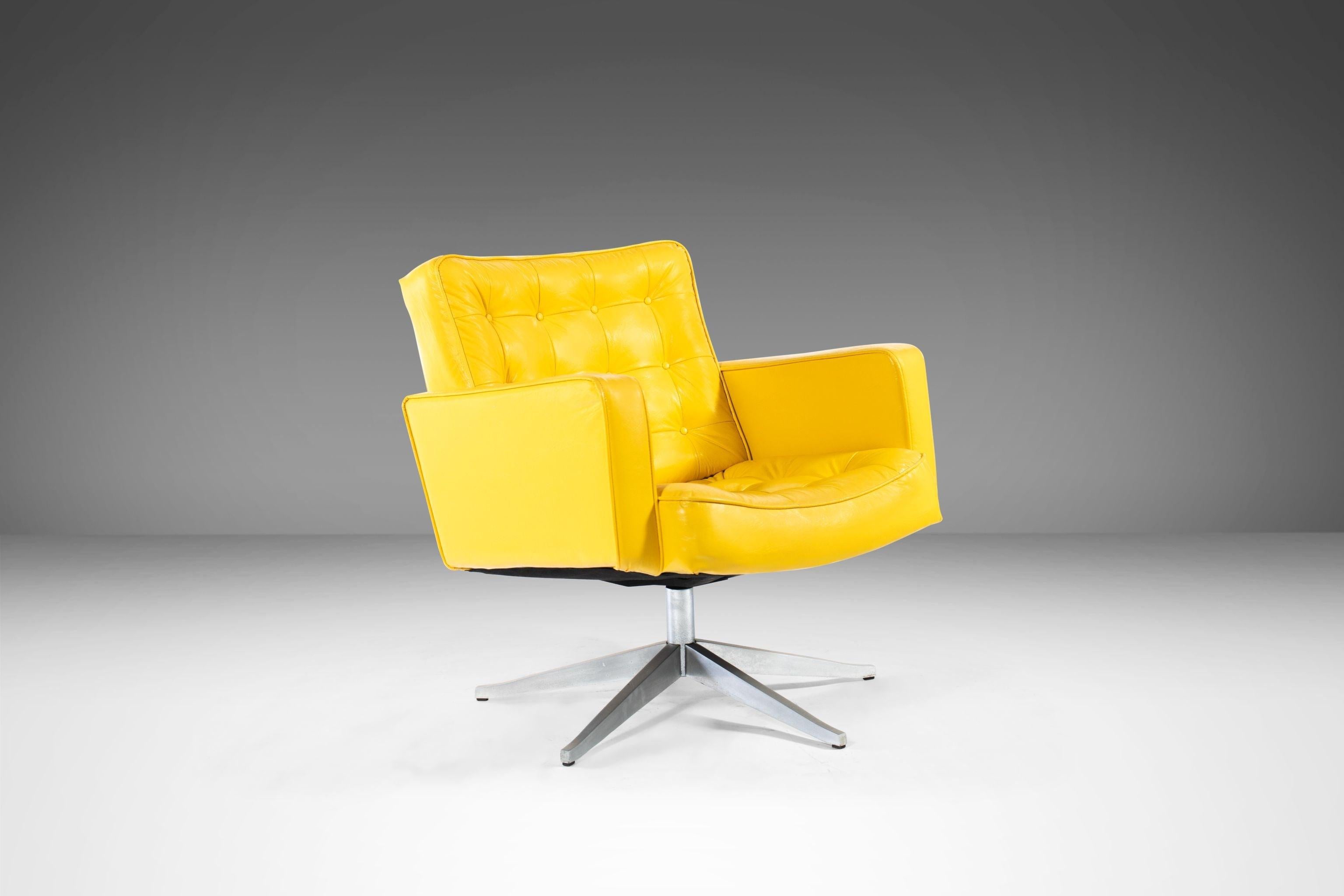 Attention designers! A gorgeous swiveling set of lounge chairs by the singular designer Cafiero for Knoll with tufted canary yellow upholstery on a five-point polished aluminum base. We've left this gorgeous set in 100% original, vintage condition