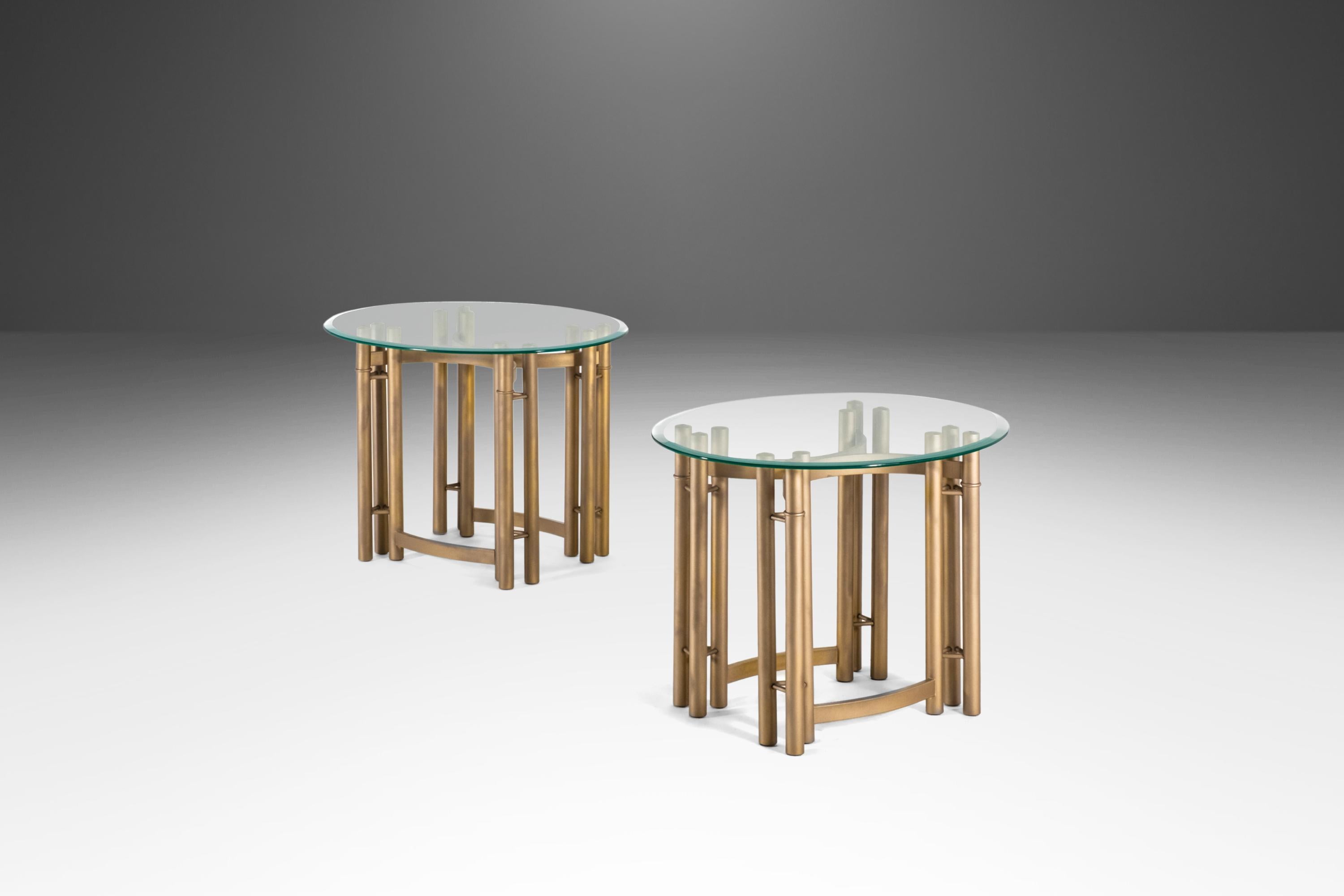 Equal parts style and luxury this fabulous set of end tables is the epitome of 'Hollywood Regency'. Freshly powder coated in an opulent gold flake this set of tables is perfect for collectors looking to add a bit of lavish flavor to their space.
