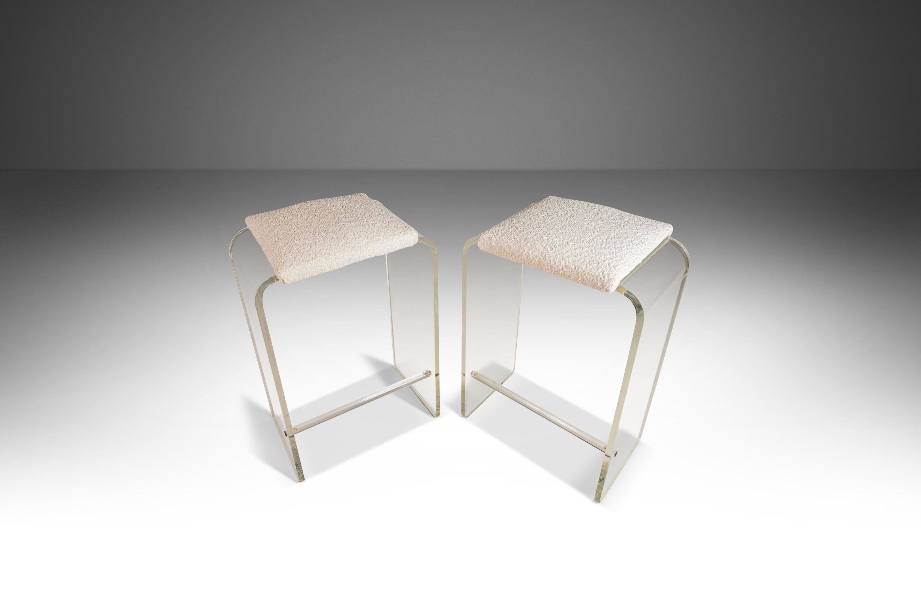 Equal parts elegance and aesthetically captivating this extraordinary set of barstools is the epitome of Hollywood Regency. Constructed from solid polymethyl methacrylate (AKA lucite) and forged into a gorgeous waterfall shape these stools are