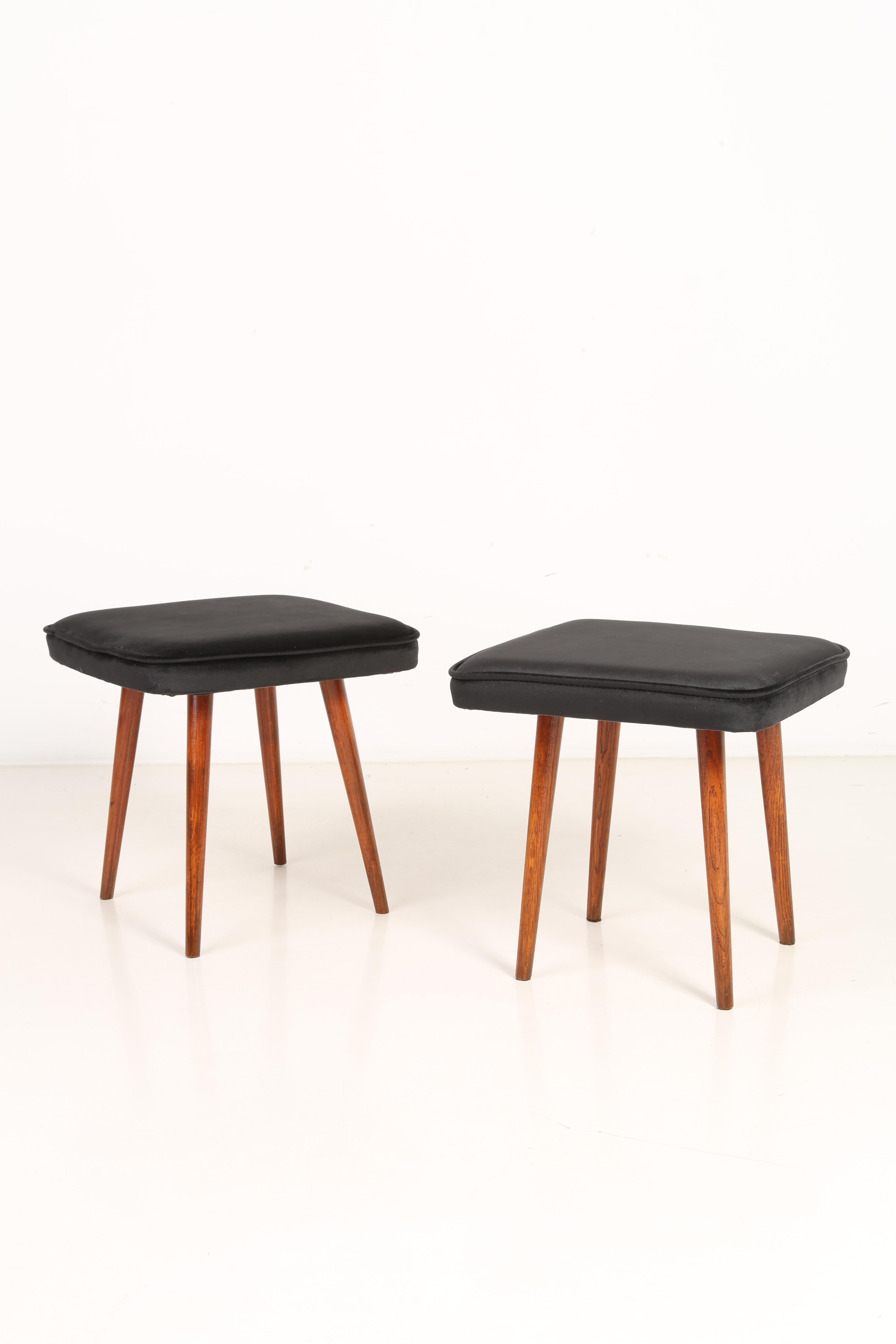 Stool from the turn of the 1960s and 1970s. Beautiful black velvet upholstery. The stool consists of an upholstered part, a seat and wooden legs narrowing downwards, characteristic of the 1960s style. We can prepare this pair also in another color