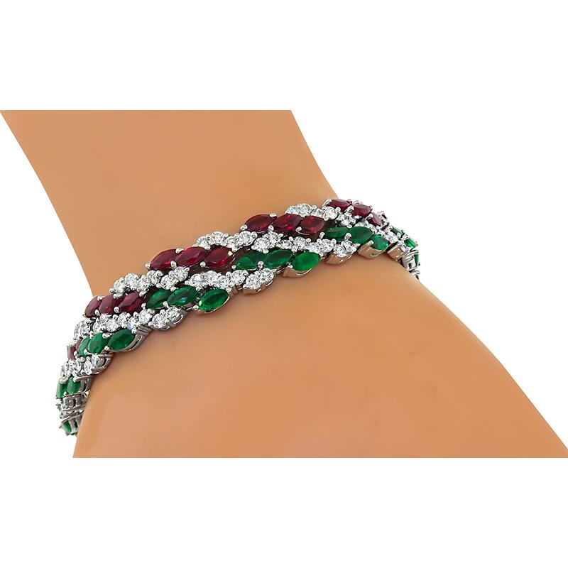 This is a fabulous set of 2 18k white gold bracelet. The bracelets feature lovely marquise cut emeralds and rubies that weigh approximately 4.00ct and 5.00ct respectively. The emeralds and rubies are accentuated by sparkling round cut diamonds that