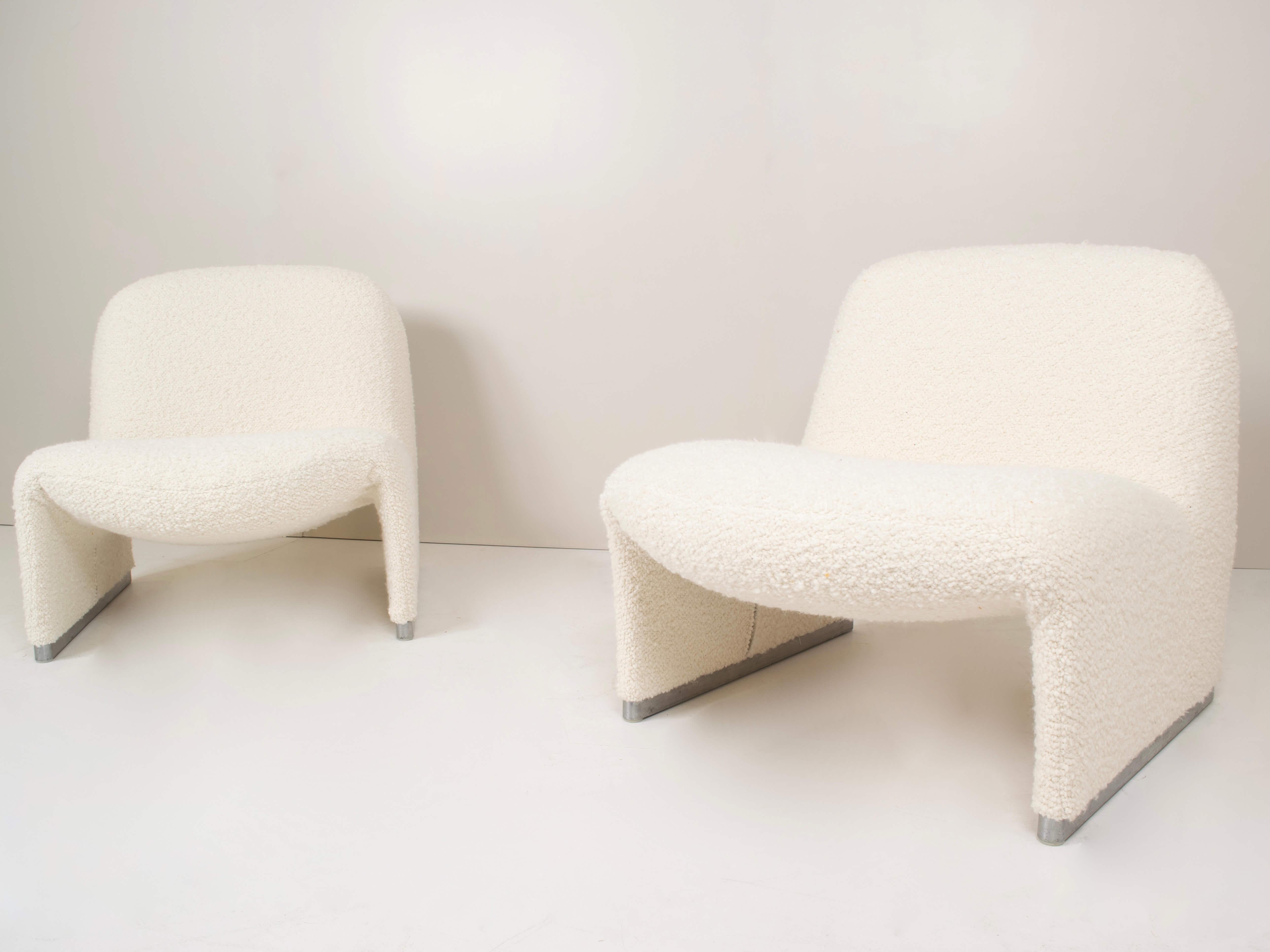 Very stylish set of two Alky chairs by Giancarlo Piretti for Artifort in Bouclé Fabric. These chairs have an aluminum frame with a chrome foot. The shape is organic and minimal. Completely new upholstered and in great condition.