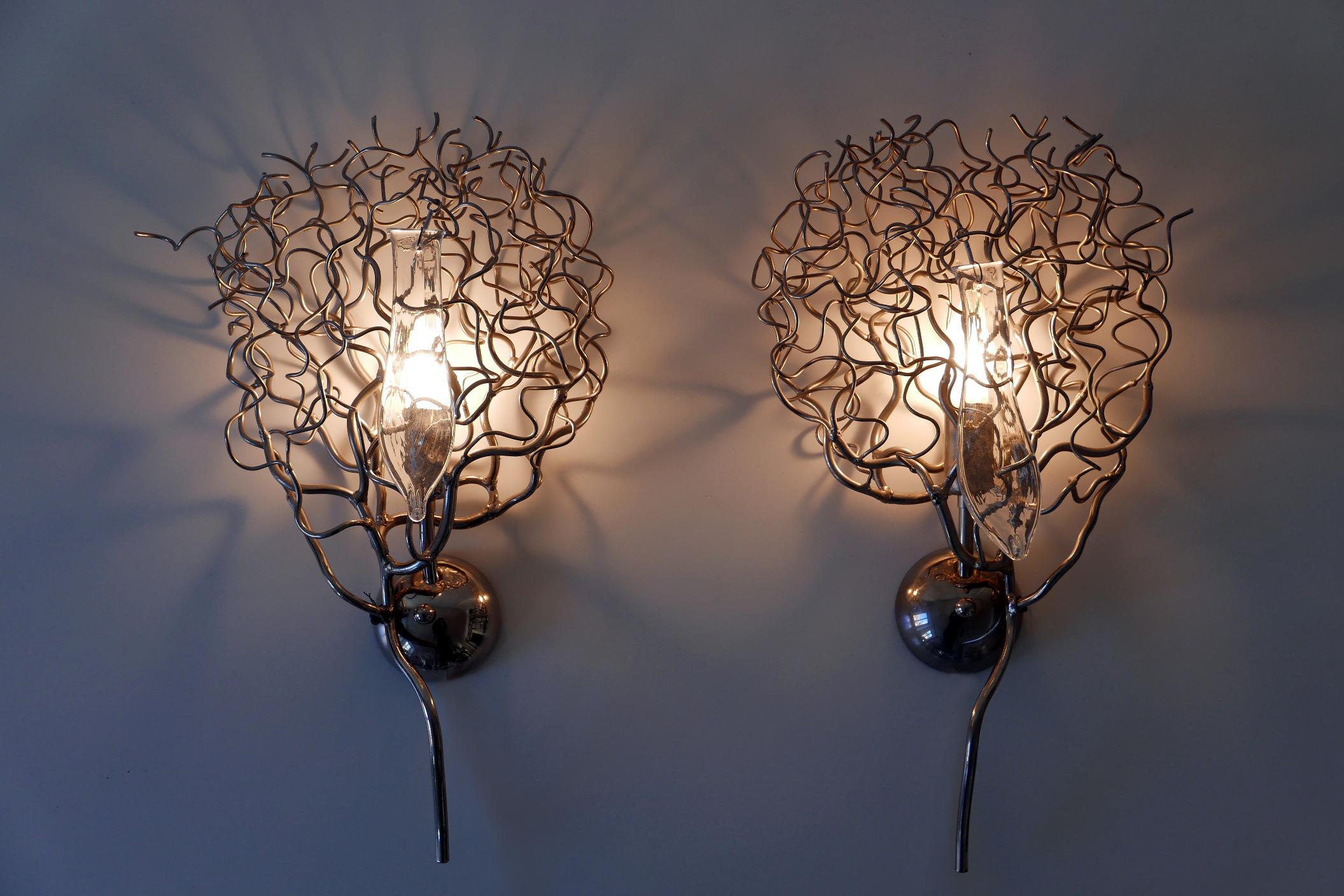Set of two amazing wall lamps / sconces 'Hollywood' in shape of a three branch. Designed by Willam Brand, 2017 for Brand van Egmond, Netherlands.

Executed in nickel and glass, each lamp comes with 1 x E14 / E12 Edison screw fit bulb holder, is