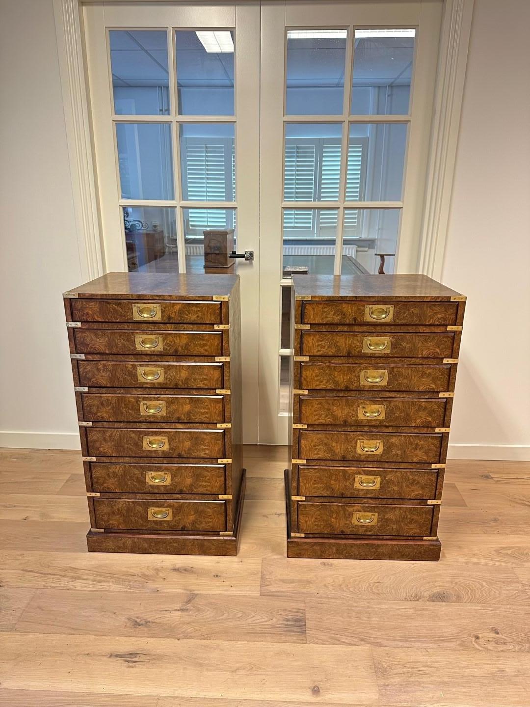 In the world of antique furniture, burr walnut wooden chests of drawers with English Campaign fittings are known as true gems of craftsmanship and timeless elegance. This beautiful set of chests of drawers tells a story of a bygone era, when English