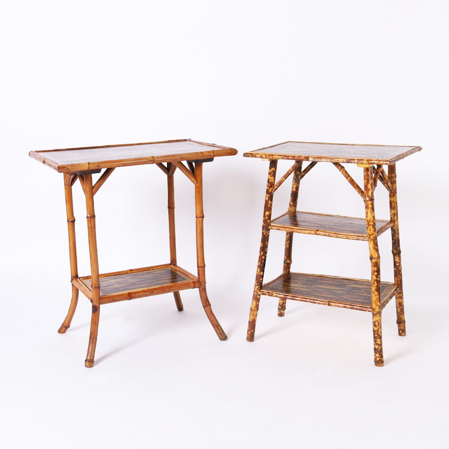 Standout set of two 19th century English bamboo tables both having multi-tier construction and panels decorated with fish decoupage.

Left: H: 28.5 W: 25 D: 16
Right: H: 28 W: 20 D: 14.5.
