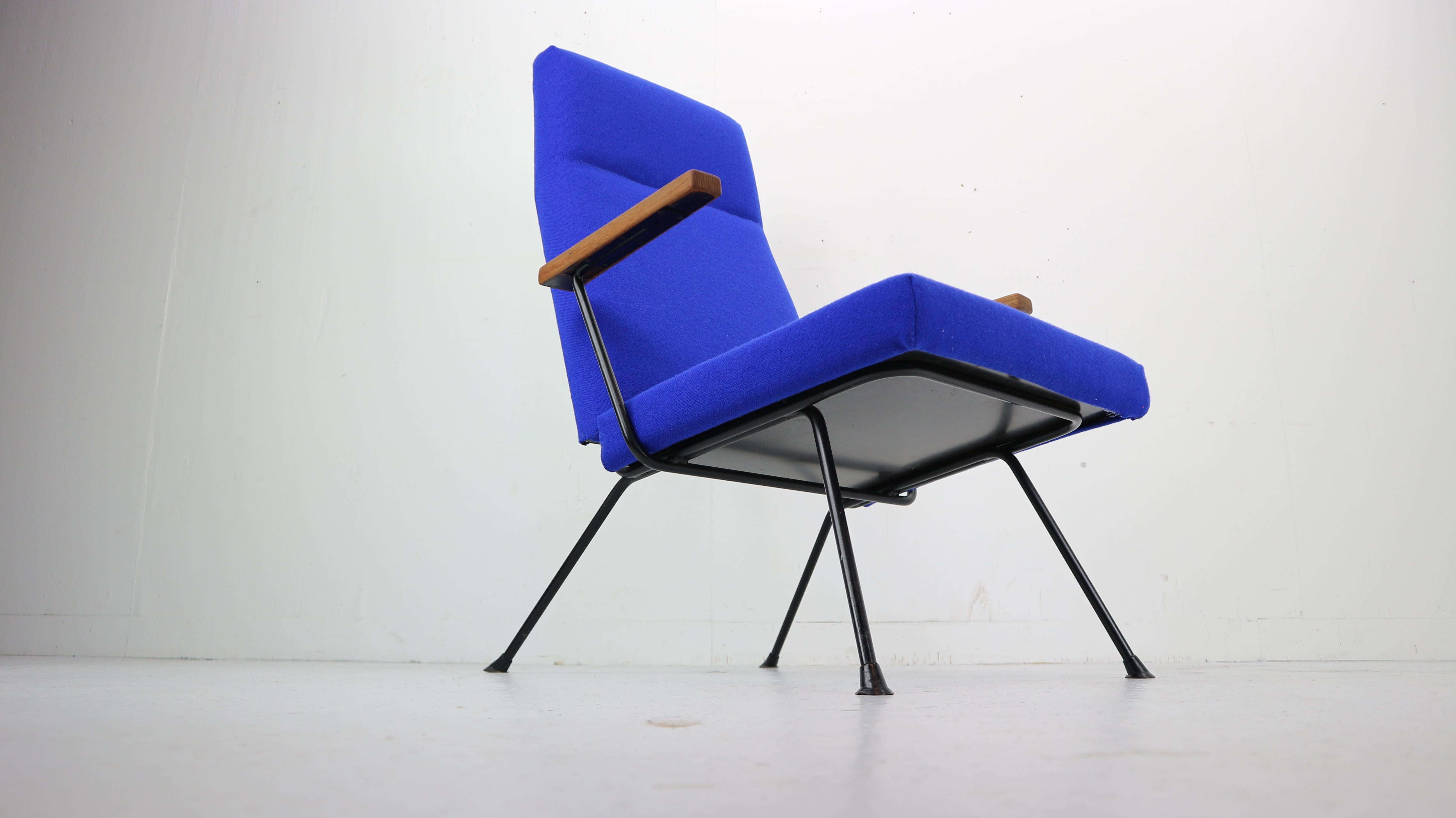 A.R. Cordemeyer 1410 easy chair designed for Gispen in 1959. This chair has been re-upholstered in a cobalt blue Kvadrat, wool fabric. The black metal frame and solid teak armrests are all in very good condition. The chairs are sold as a set.