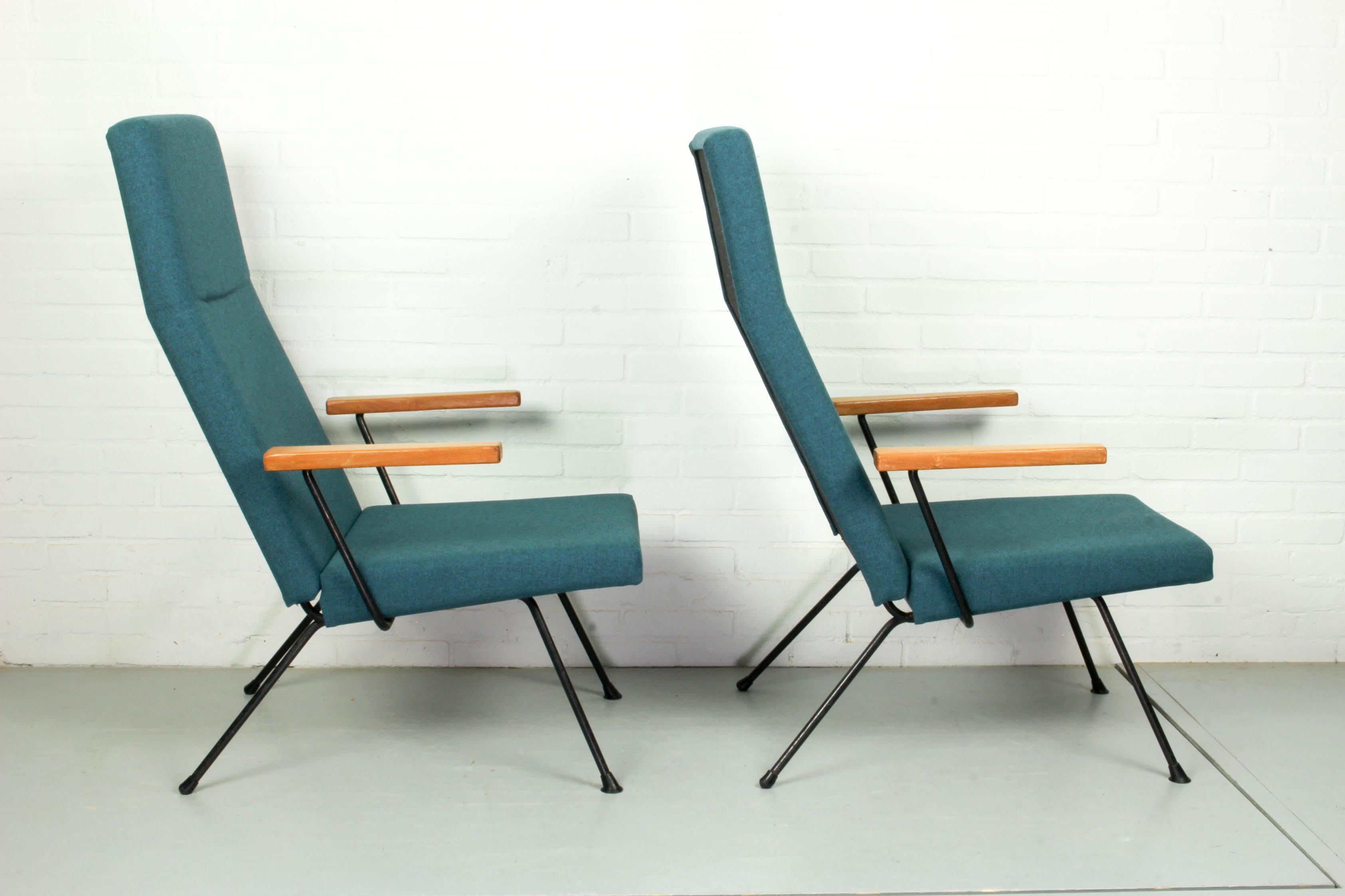 A.R. Cordemeyer 1410 easy chairs designed for Gispen in 1959. These chairs have been re-upholstered in Kvadrat Tonica blue grey fabric (color 831), black metal frame and solid teak armrests, all in very good condition. This model (1410) is identical