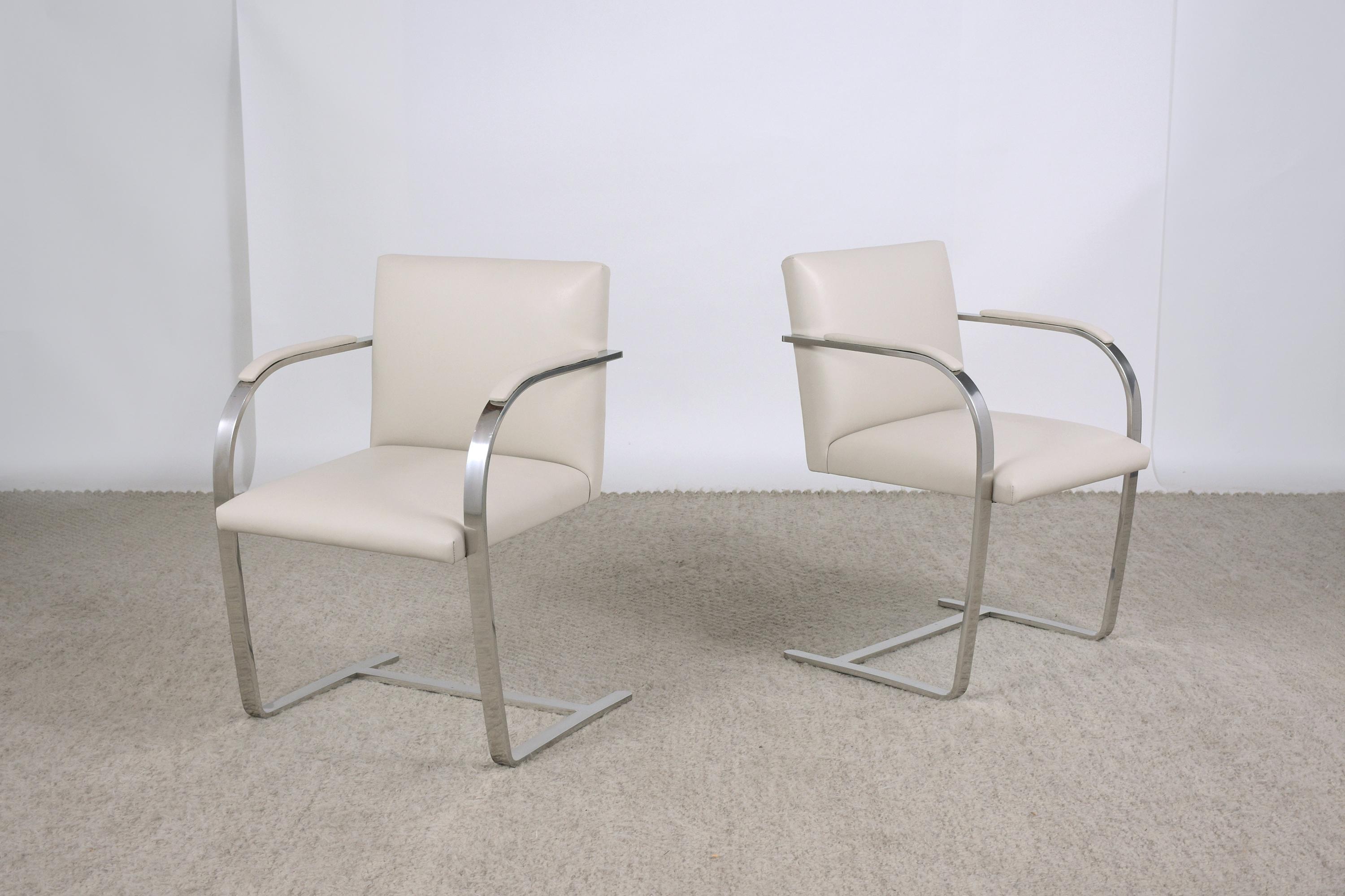 An extraordinary set of two Mies Van Der Rohe Brno armchairs by Knoll is in great condition and has been newly upholstered by our team of expert craftsmen. The chairs have a sturdy steel frame that has been polished/buffed and is newly upholstered