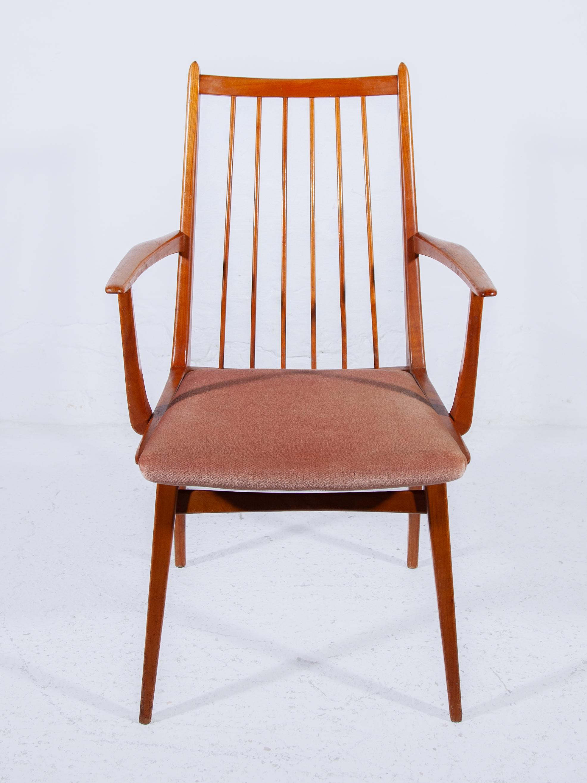 Sophisticated sculptural set of mid century dining chairs, made in Germany, by Dettinger model Casala. The set consists of 2 armchairs, and 4 side chairs. The solid wood frames are all in good, original condition, sturdy, light and ready to use. The