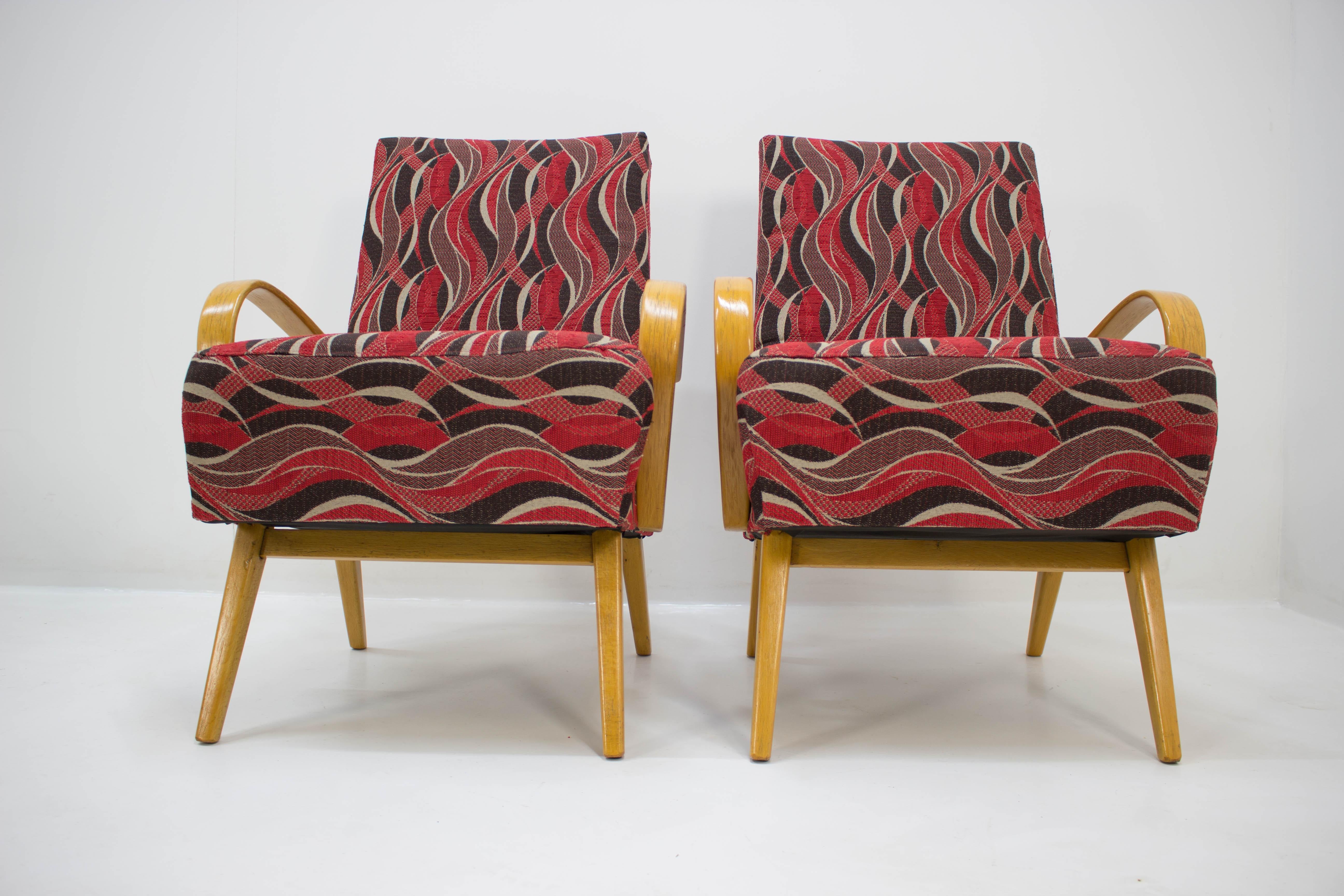 This is a pair of type 53 armchairs designed by architect Jaroslav Smidek and manufactured by TON during the 1960s. It features a bent beech frame and crazy timeless colored upholstery. This piece represents the Brussels style, which formed after