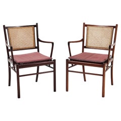 Set of two armchairs from Ole Wanscher in mahogany, cane and fabric Denmark 1960
