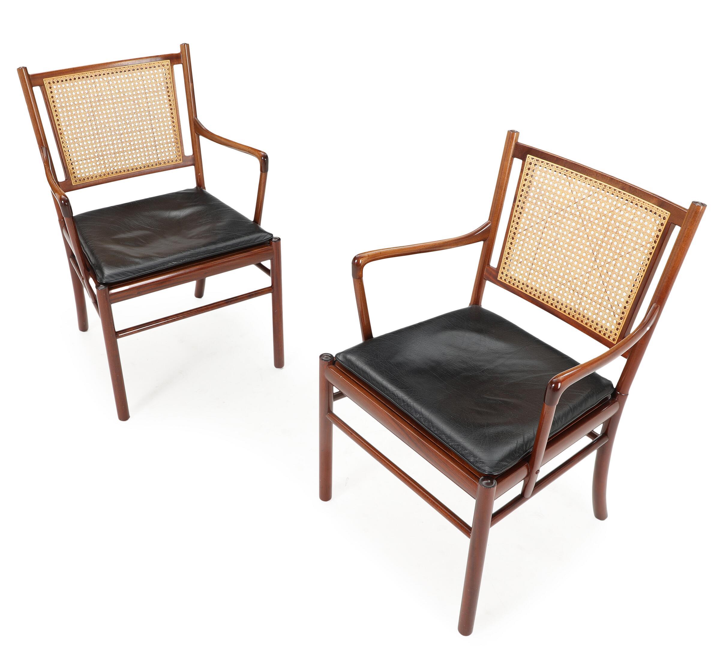 Pair of ‘Colonial’ armchairs, model PJ301 in mahogany, cane and original leather. Elegant pair easy chairs with a mahogany slim frame by the Danish designer Ole Wanscher. These chairs show the great craftsmanship and attention to detail that Ole
