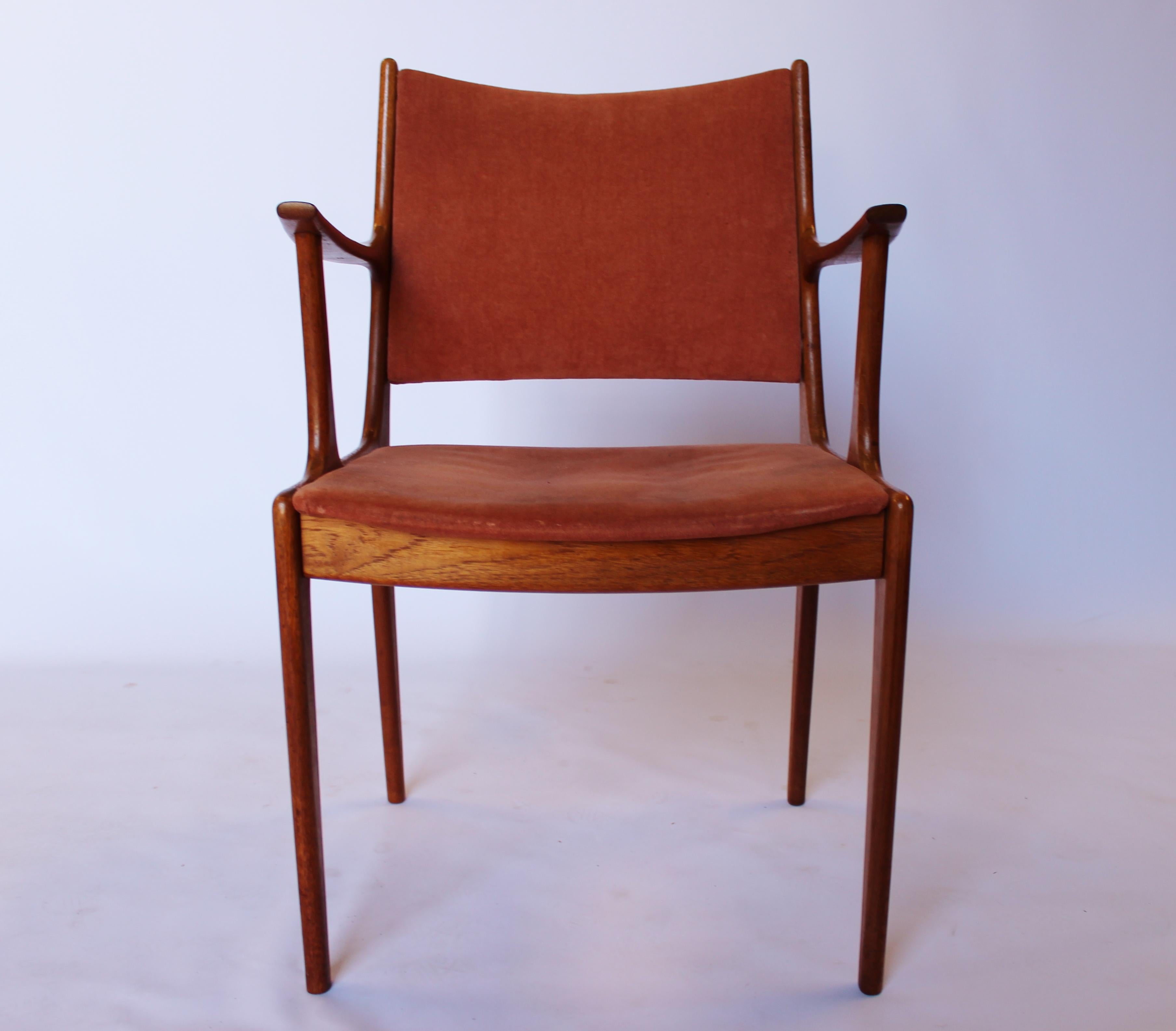 Set of two armchairs in teak and pale pink suede designed by Johannes Andersen and manufactured by Uldum Furniture Factory in the 1960s. The chairs are in great vintage condition.