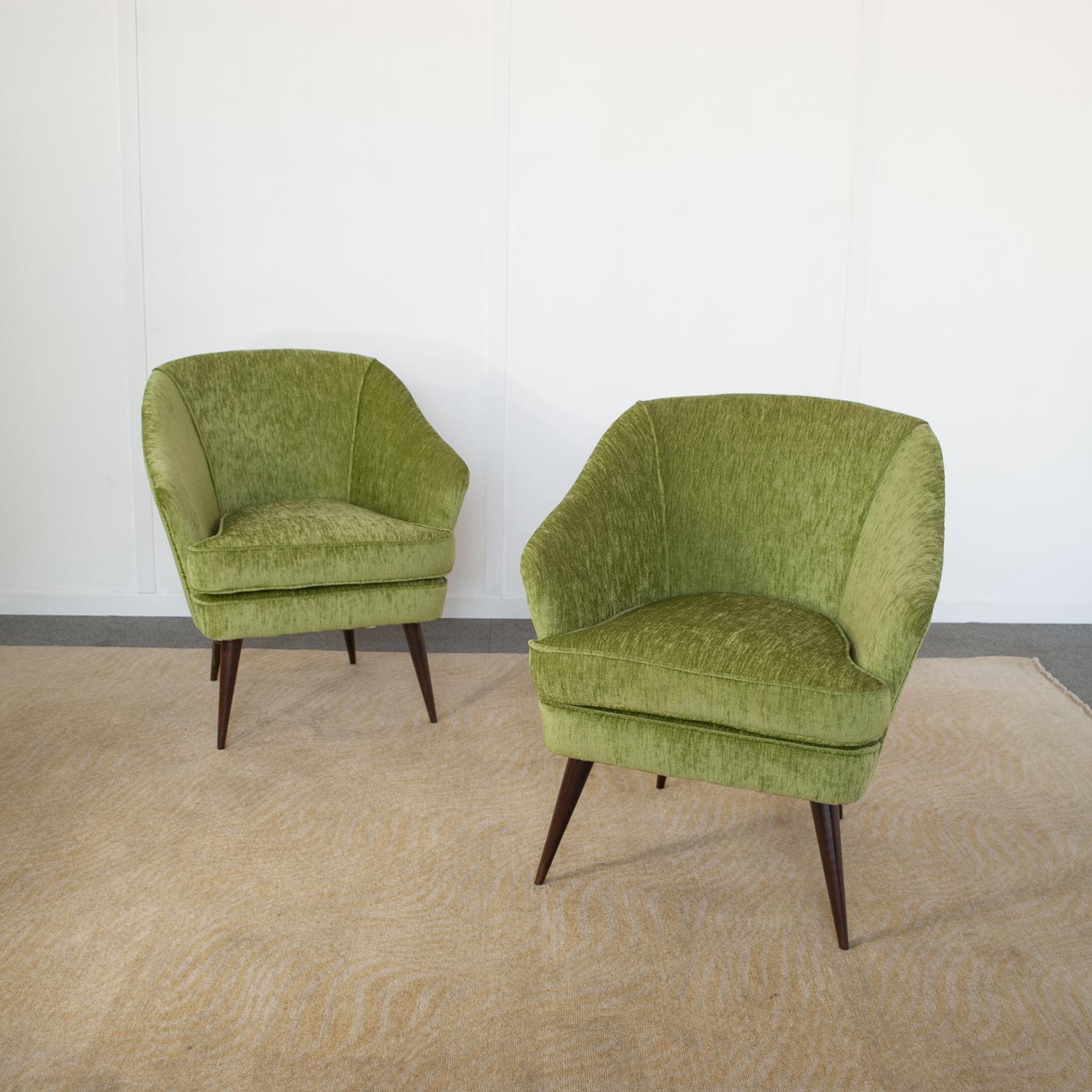 Set of two armchairs manufactured by Casa e Giardino designer Gio Ponti 1940 .

Gio Ponti designed many objects in a wide variety of fields, from theatre sets, lamps, chairs, kitchen objects and the interiors of ocean liners. Initially in the art of