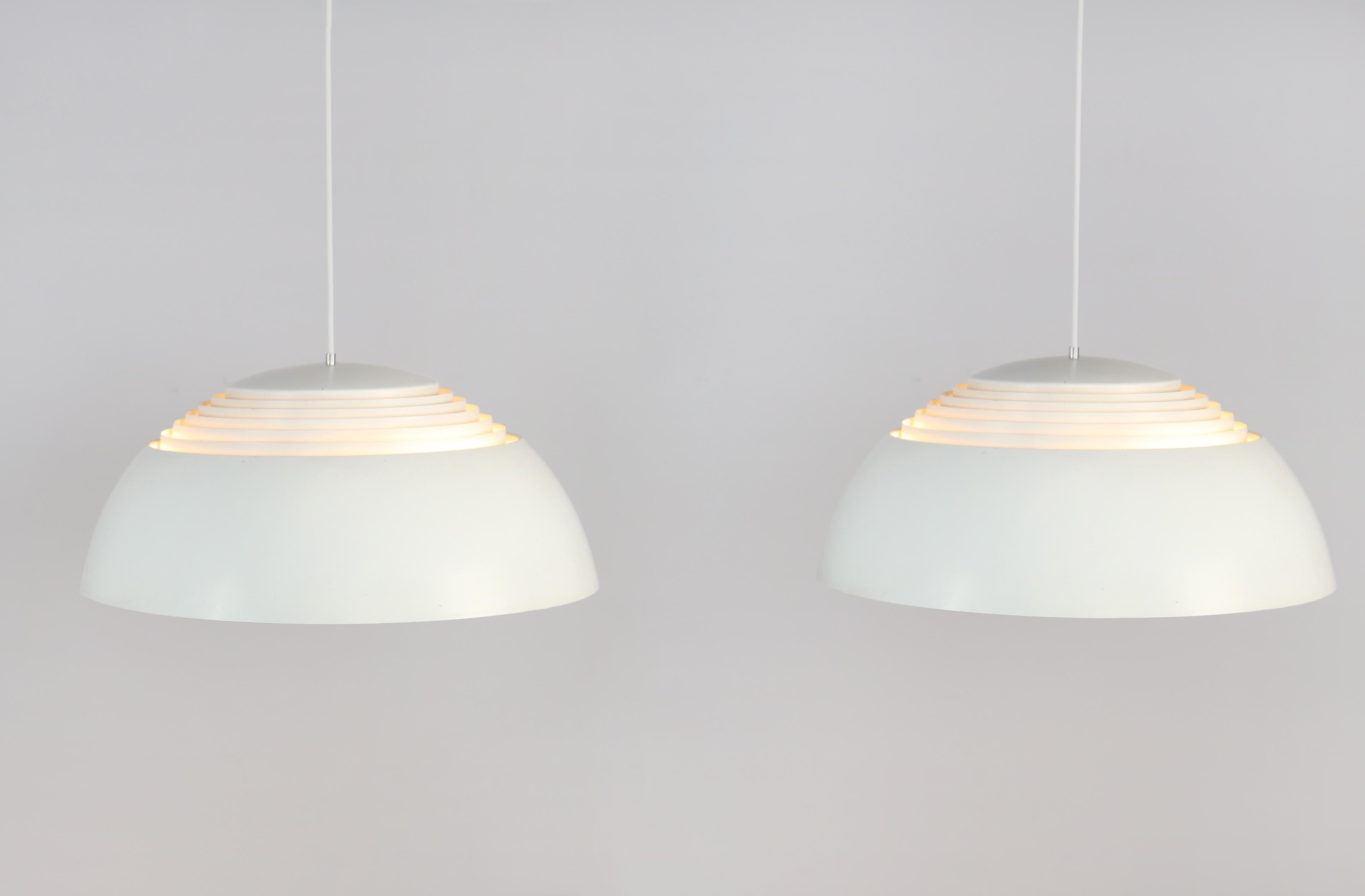 These AJ Royal lamps were designed by Arne Jacobsen for Louis Poulsen in the 1960s for the Royal SAS hotel in Copenhagen. The nice thing about these lamps is that they shine both light upwards and downwards due to the design of the lamp, which uses