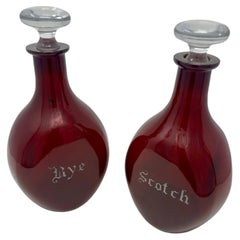 Set of Two Art Deco Cranberry Red Pinch Glass Decanters with Silver Overlay