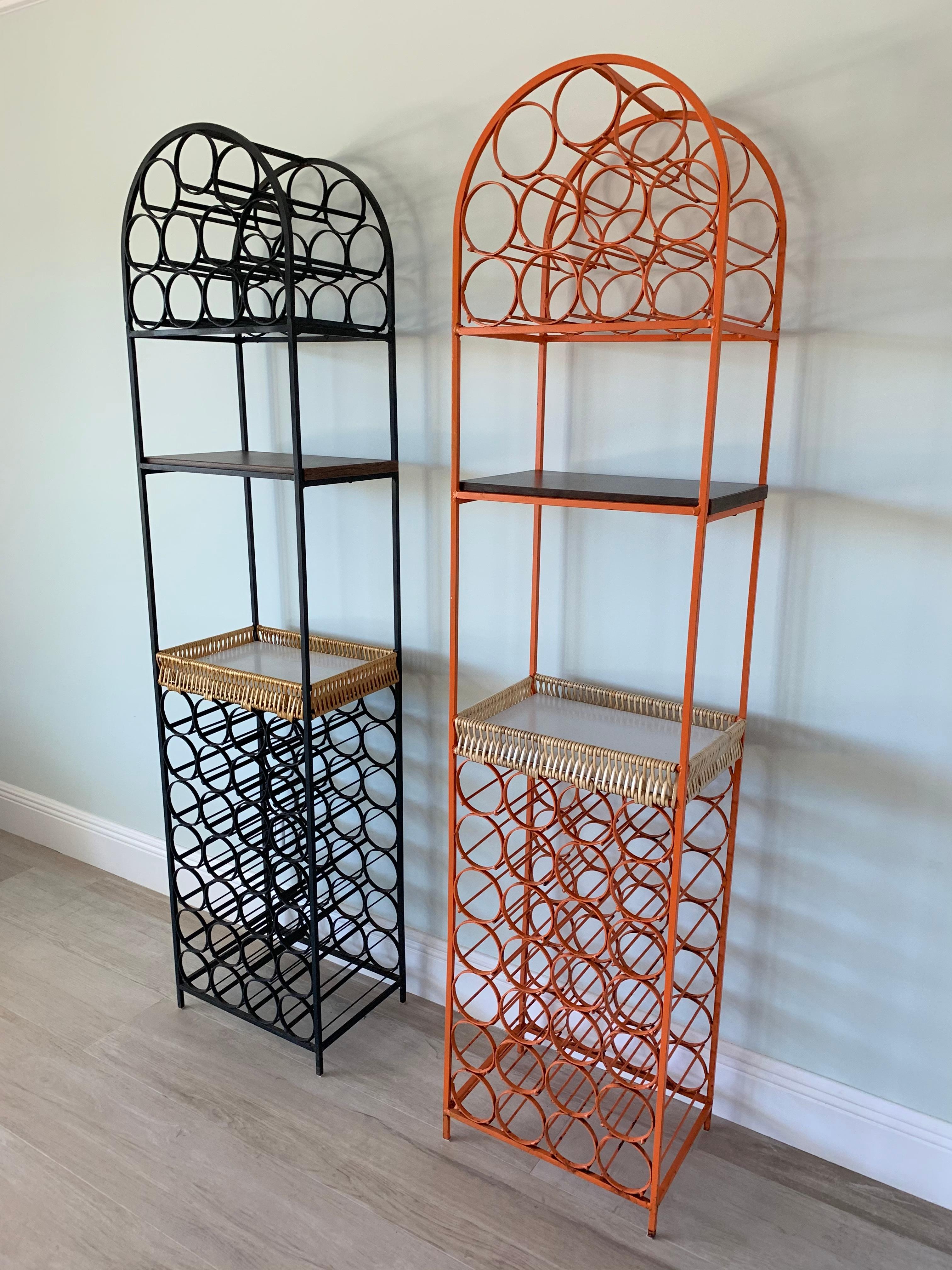 Set of two wrought iron wine racks by Arthur Umanoff.
Rare orange and black lacquered metal. Original lacquer on both.
Each racks can hold up to 39 bottles and include a woven basket type shelf and a laminated shelf to hold glasses, serve drinks