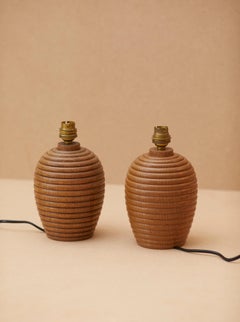 Set of two artisanal turned wood table lamps in solid oak, France c. 1940