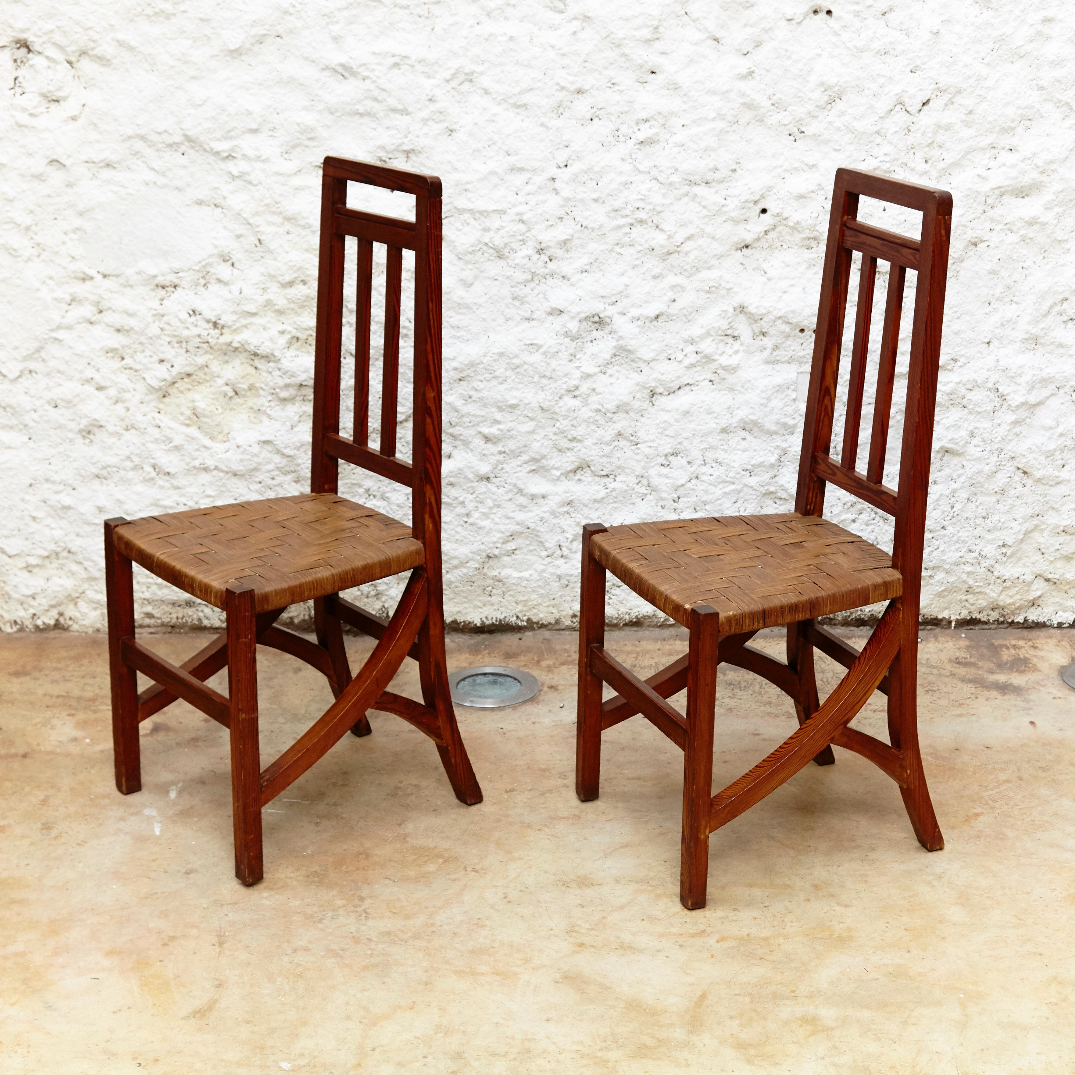 Set of two Arts & Crafts chairs in wood and rattan, circa 1910
By unknown designer and manufacturer.
Manufactured in Spain, circa 1910.
Wood and rattan.

In original condition with minor wear consistent of age and use, preserving a beautiful