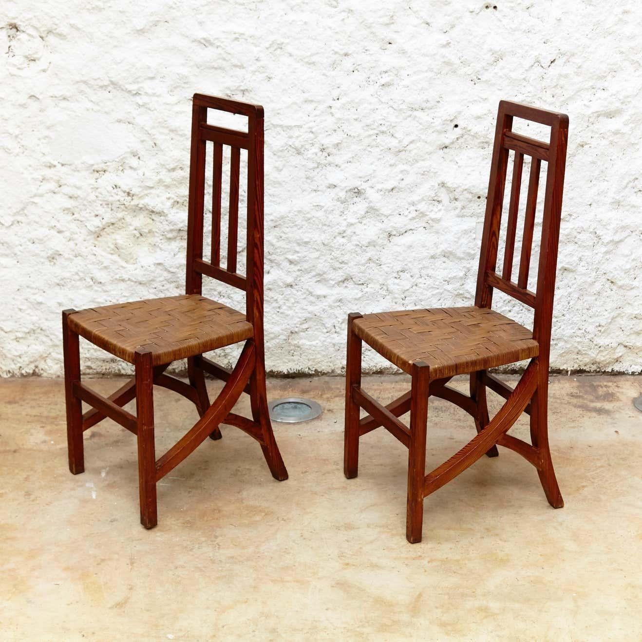 Set of two Arts & Crafts chairs in wood and rattan, circa 1910
By unknown designer and manufacturer.
Manufactured in Spain, circa 1910.
Wood and rattan.

In original condition with minor wear consistent of age and use, preserving a beautiful patina.