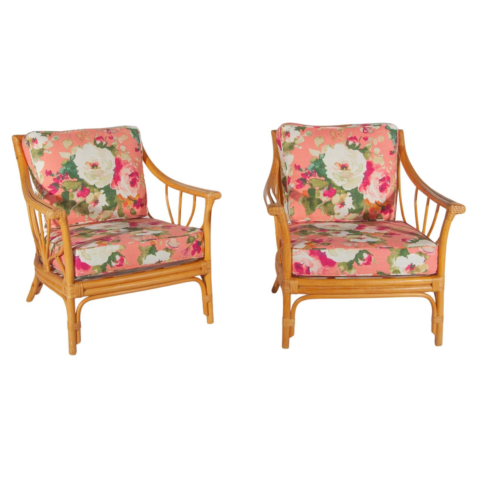 Set of two lounge chairs very stylish quality vintage bamboo designed in Italy 1960's. The lounge chairs has renewed upholstered cushions in a soft color floral outdoor fabric. 
The set can be used well on your patio or in your living room annex sun