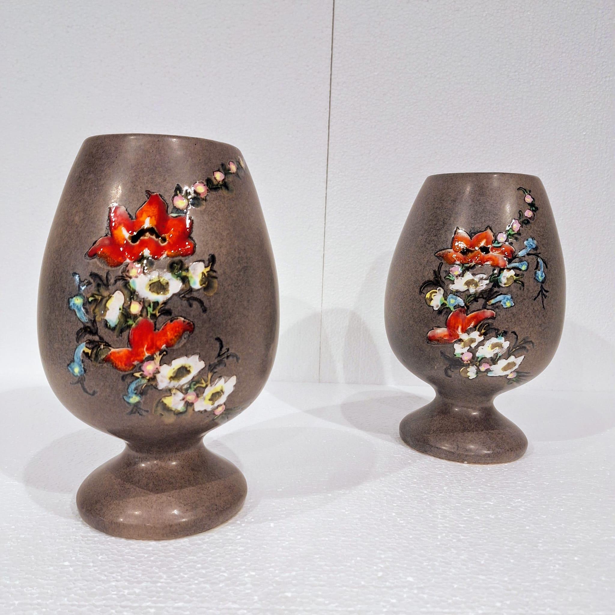 Set of two beautiful ceramic vases from Vallauris dating from the 1970s and signed Mabyjo's Massara.

Both vases feature hand-drawn floral designs with lovely bright colors.
